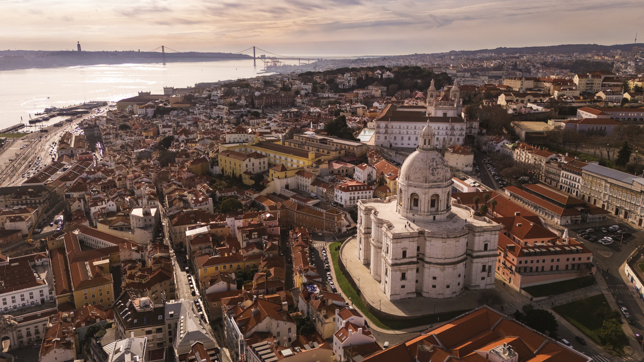 Drone panorama of Lisbon with the National Pantheon, Tagus River and 25 de Abril Bridge