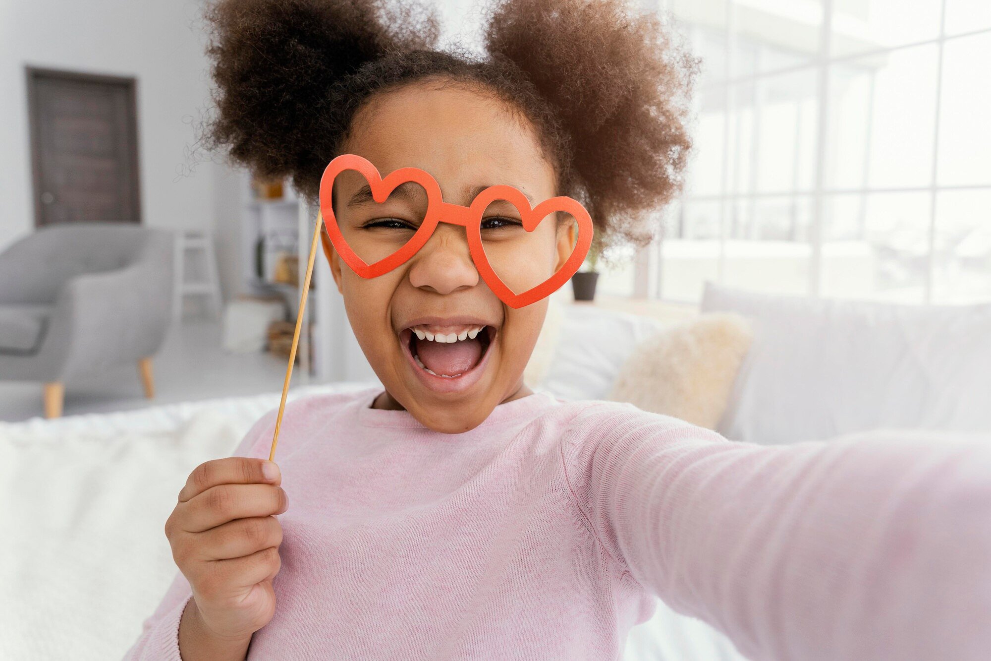front-view-little-girl-taking-selfie-home_23-2148890954.jpg