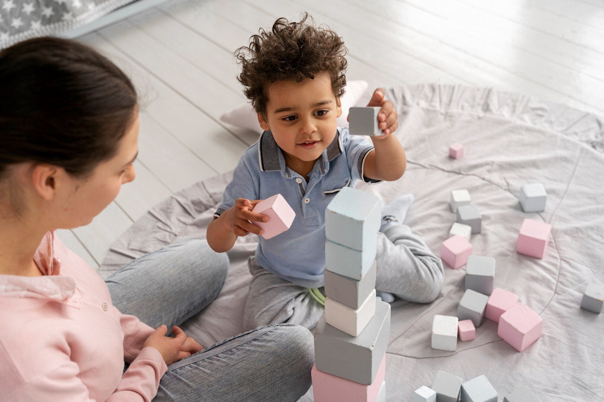close-up-child-enjoying-didactic-game_23-2149316892.jpg