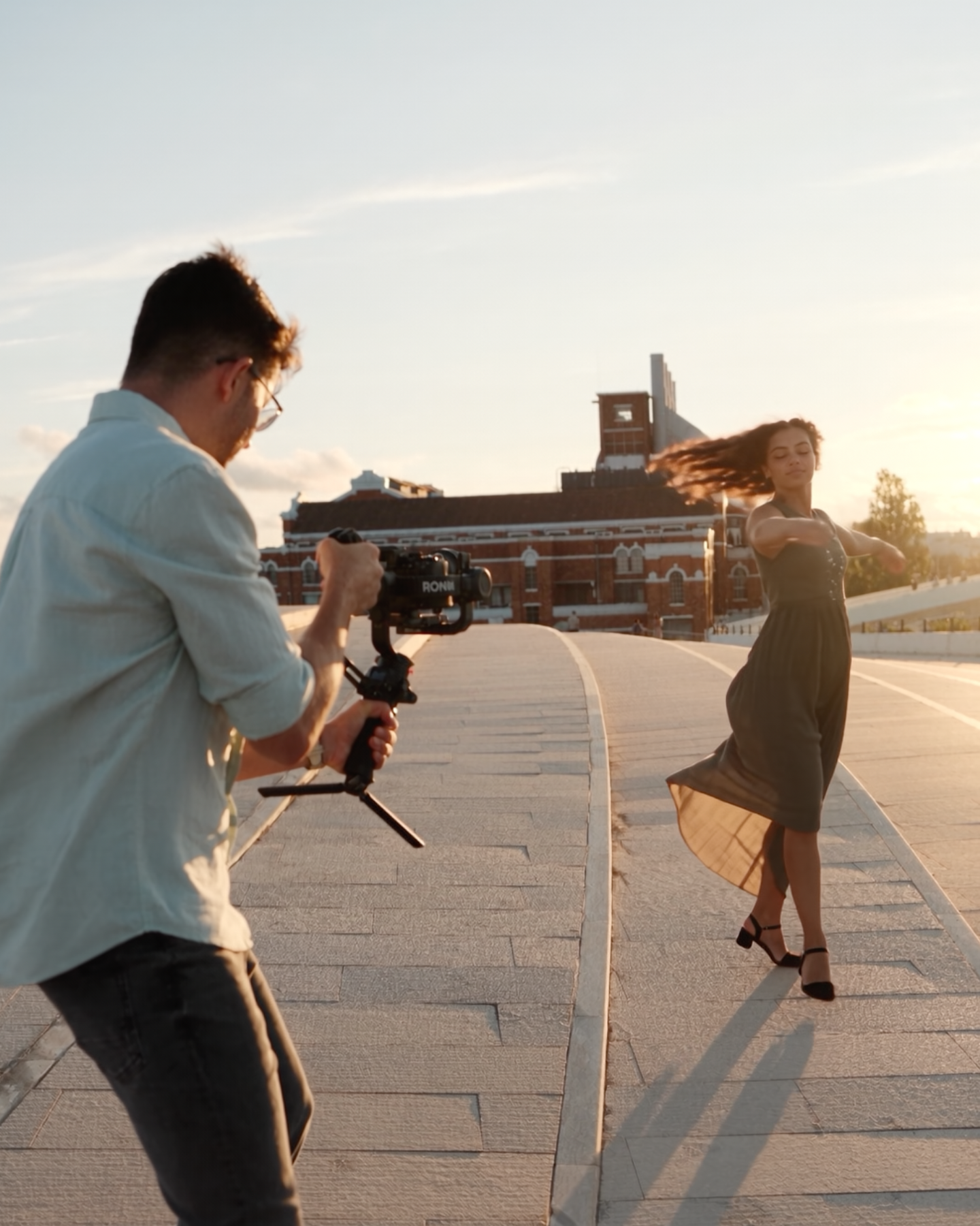 Yaroslav, Lisbon videographer filming a model on a rooftop at sunset, behind the scenes