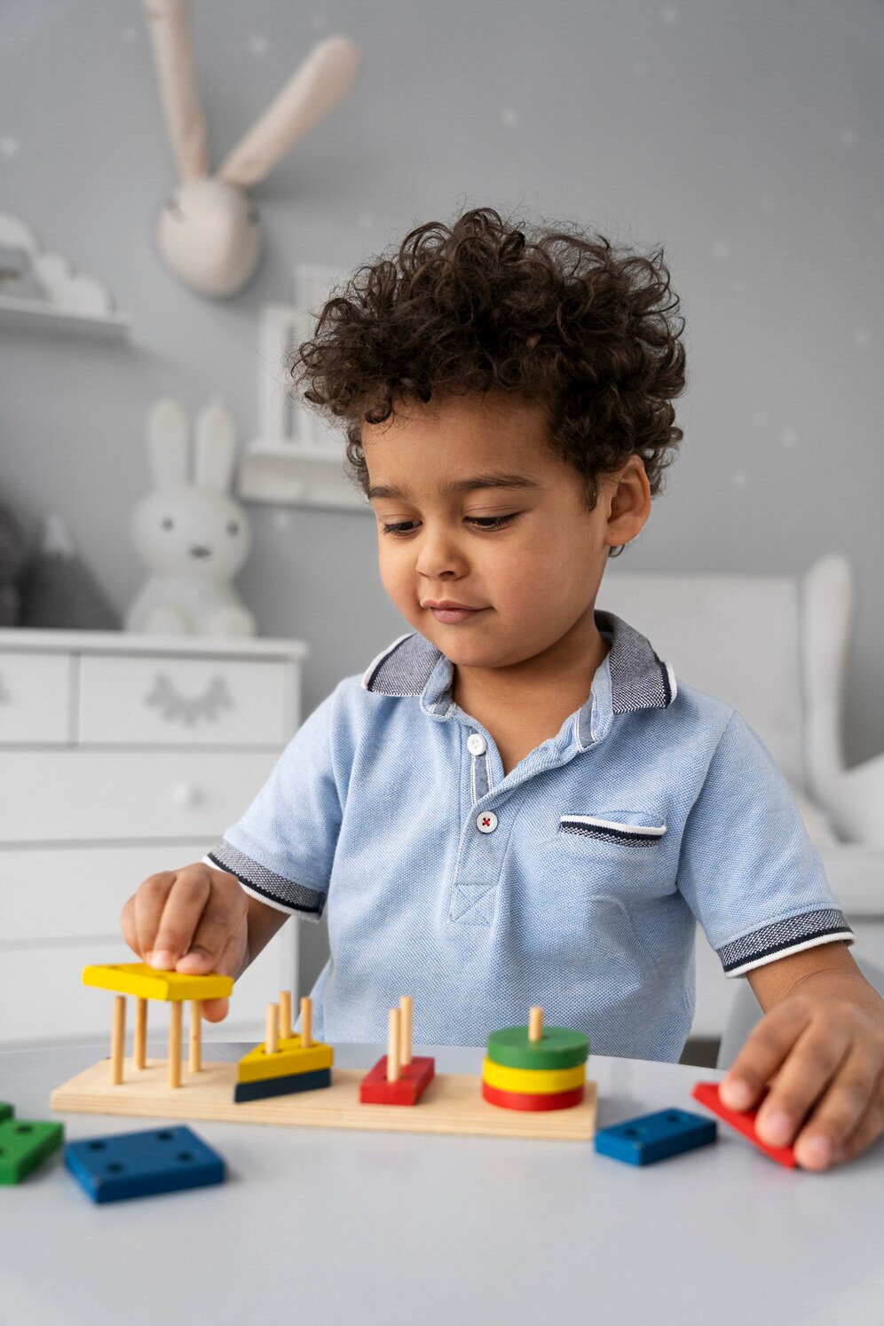 close-up-child-enjoying-didactic-game_23-2149316910.jpg