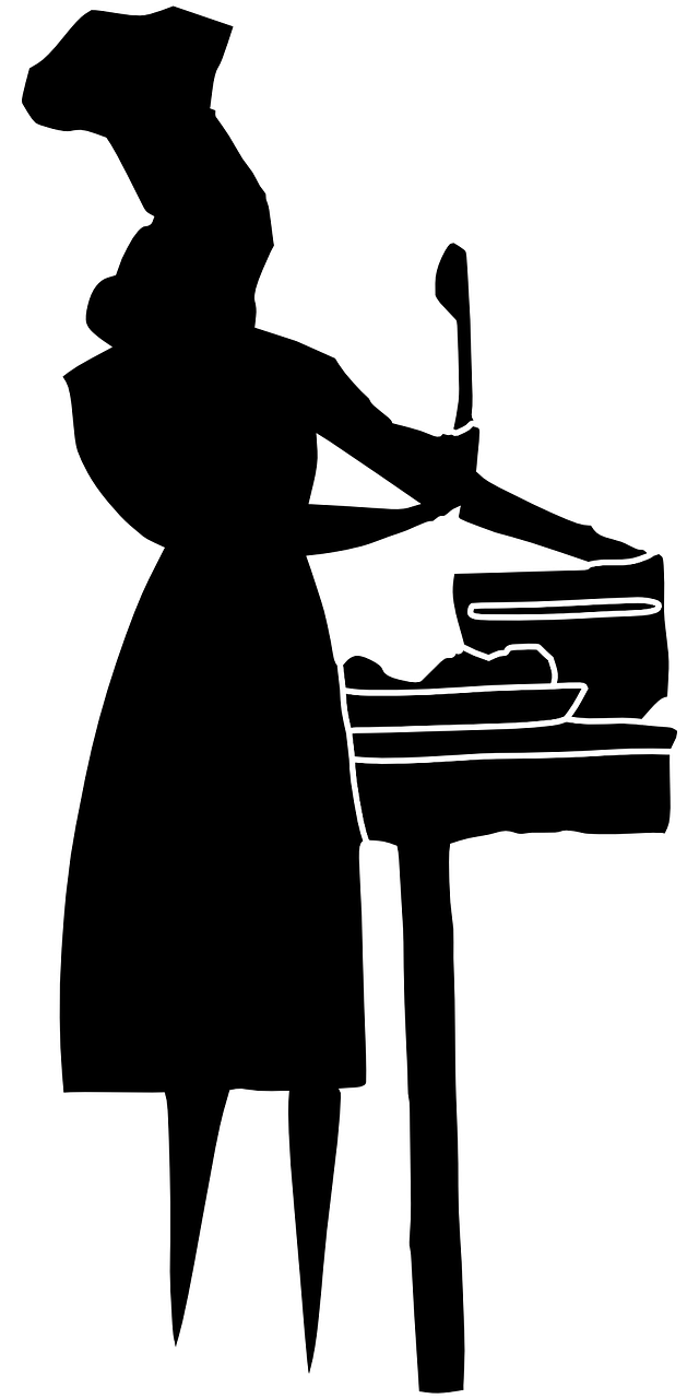 Silhouette einer Frau beim Kochen in der Küche.