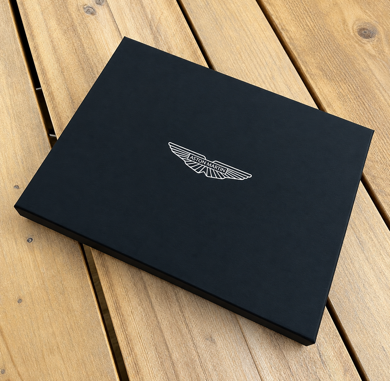 Aston Martin Box on Rustic Wood.png