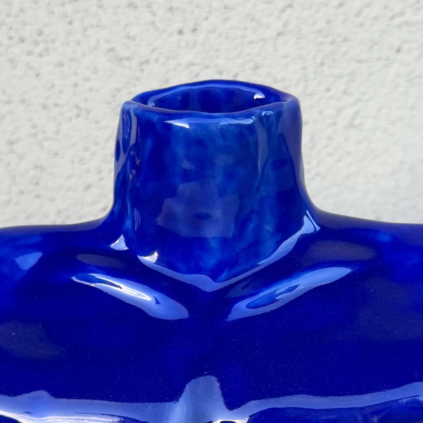 Custom blue vase for Charity

Loved getting back into the practice of sculpture after spending so much time on the wheel at the end of the year! She asked for &ldquo;technicolor&rdquo;, &ldquo;Dairy Queen dip cone&rdquo; and &ldquo;female form adjace