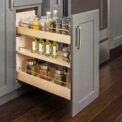 Custom kitchen cabinetry with pullout drawers for organizing bottles in OKC.