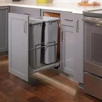 Custom kitchen cabinetry with double trashcan pullout drawer in Oklahoma City.