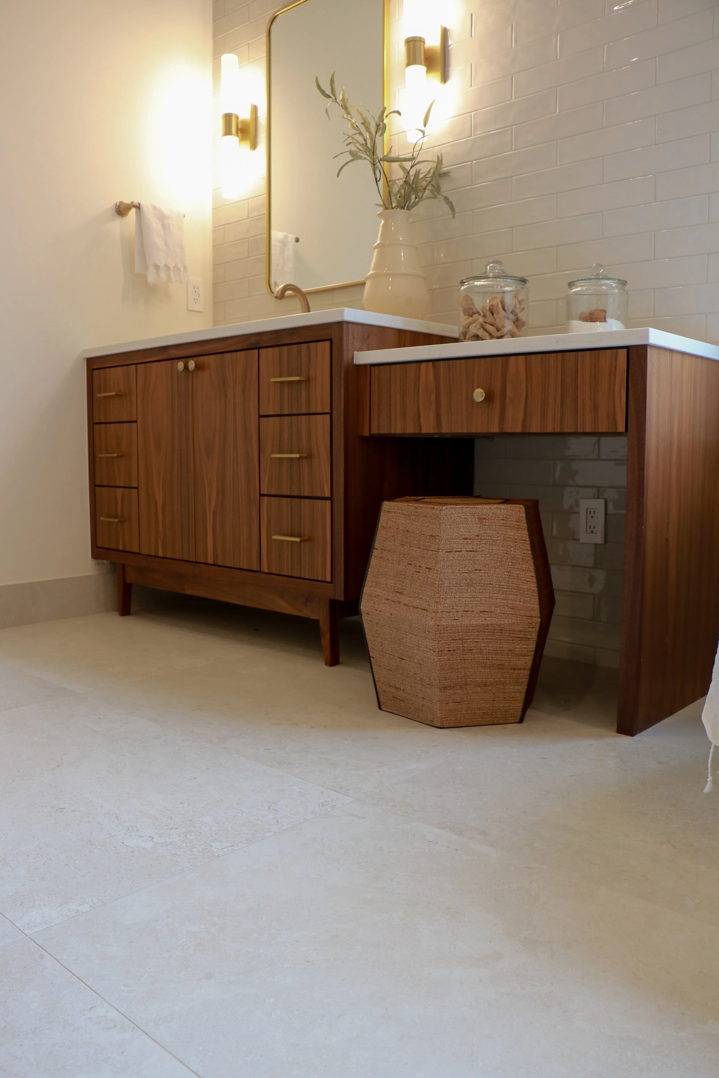 Vanity with grain-matched walnut slab doors in Oklahoma City.