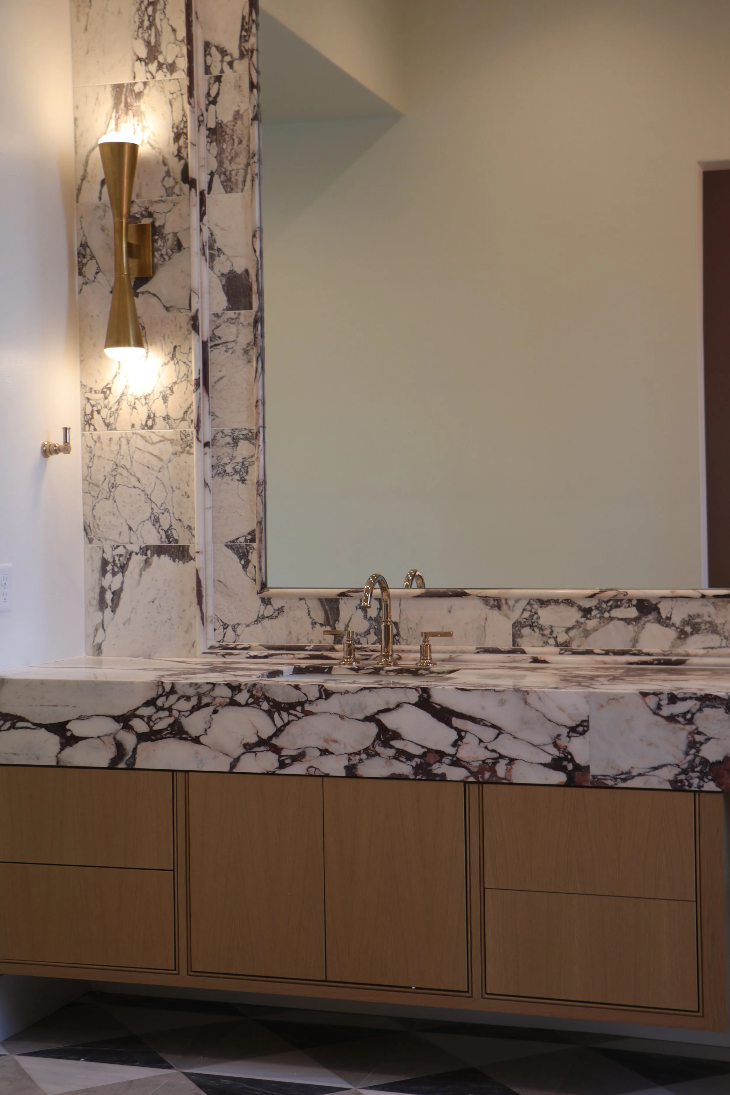 Floating rift-sawn white oak bathroom cabinet with inset slab doors in Oklahoma City.
