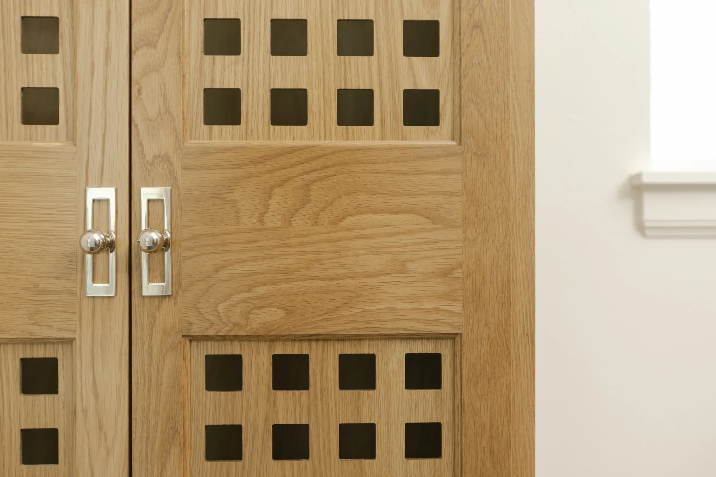 Custom stained red oak cabinet doors with cutouts in OKC.