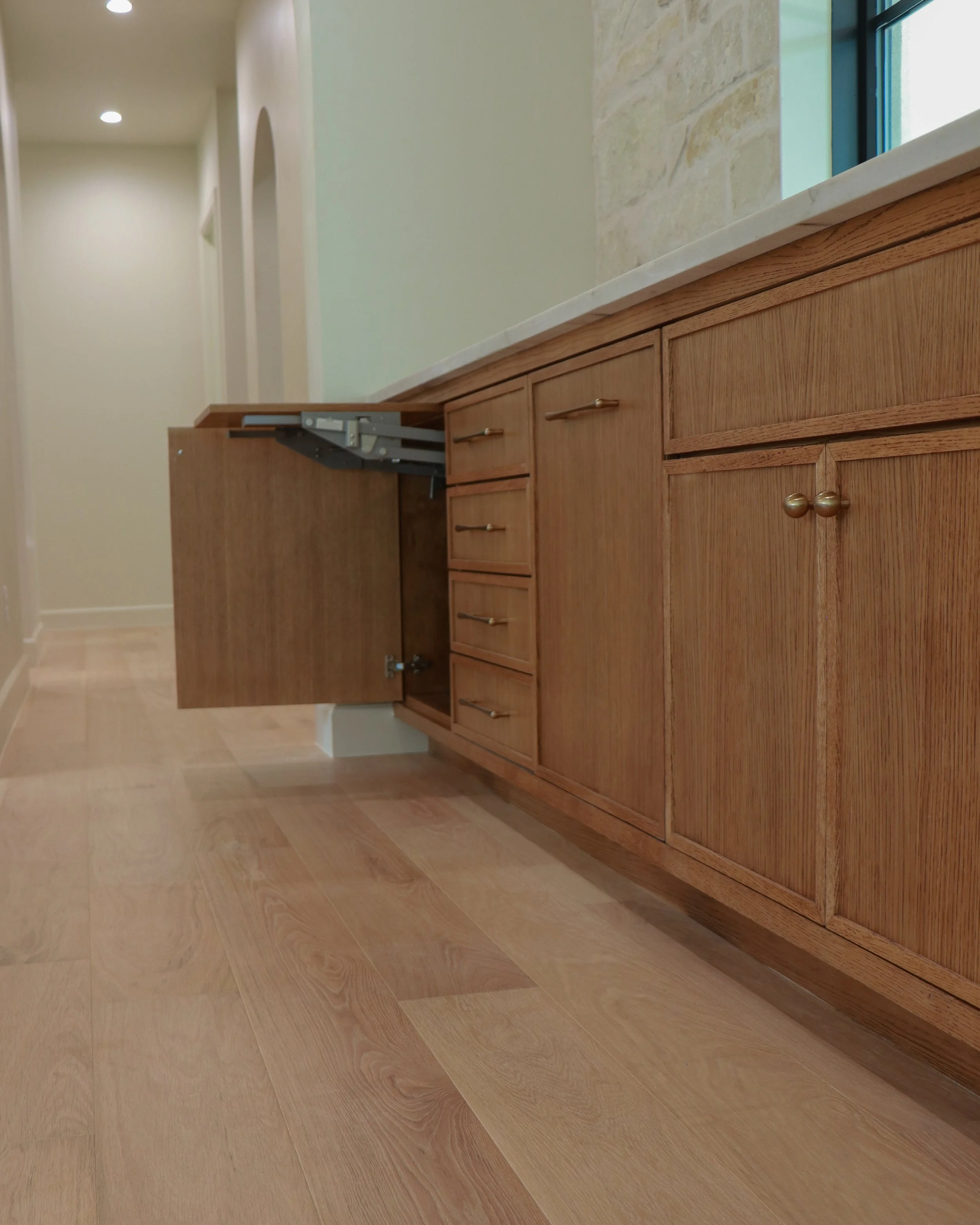 Kitchen cabinets featuring rift-sawn white oak, shaker doors, and a mixer lift in OKC.