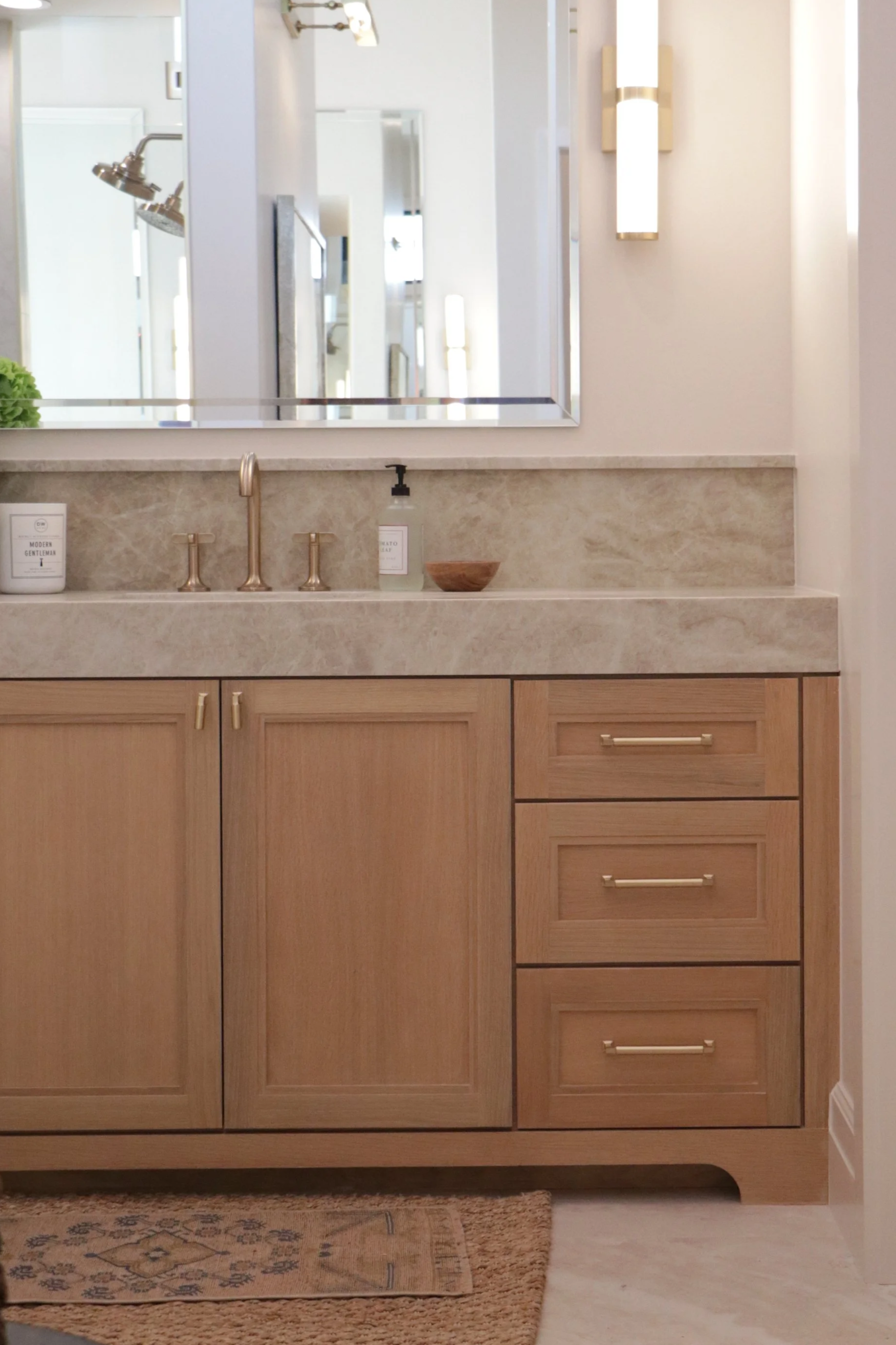 Custom bathroom cabinet with shaker doors and a decorative toe in OKC.