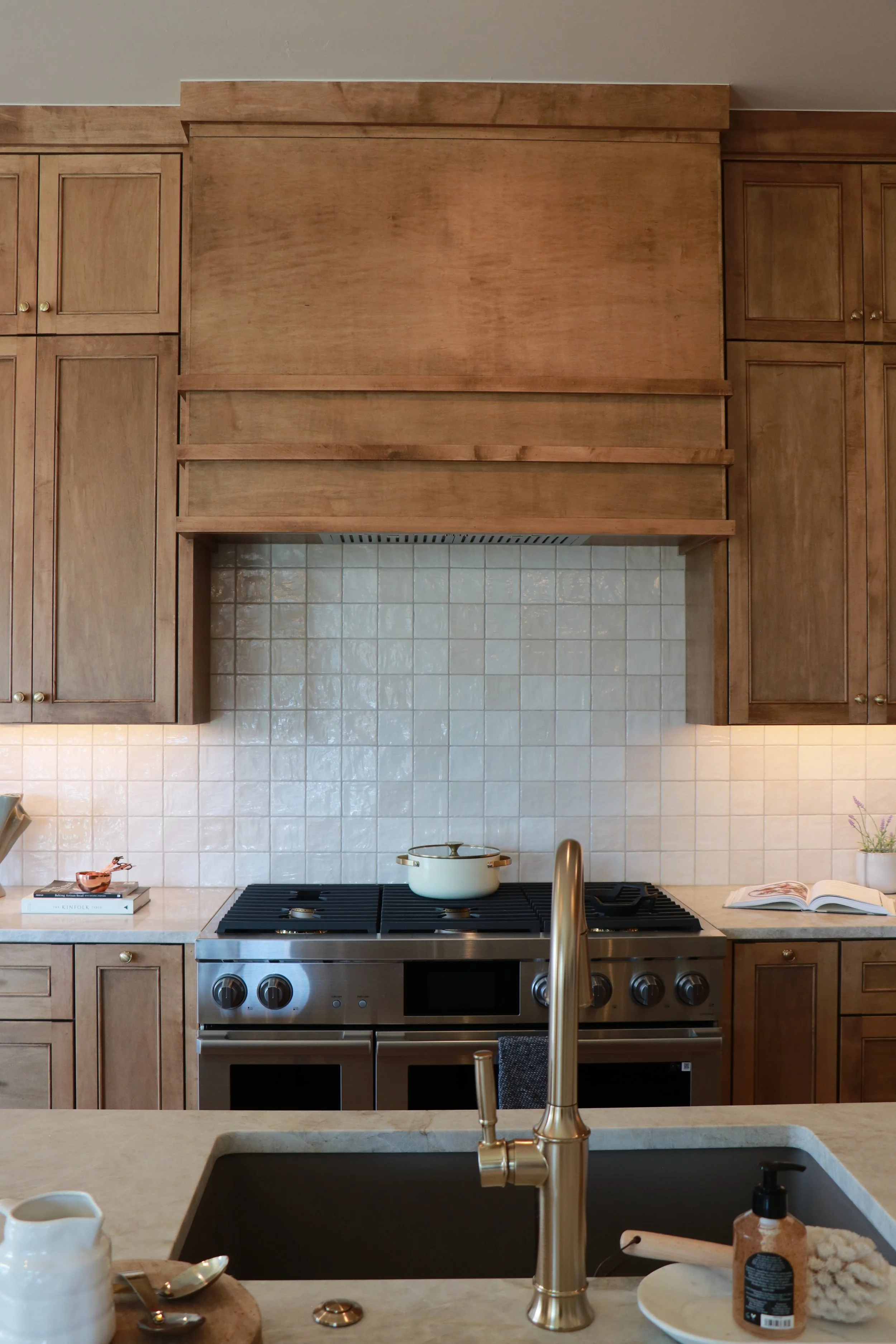 Custom maple vent hood and modified beaded shaker door in OKC.