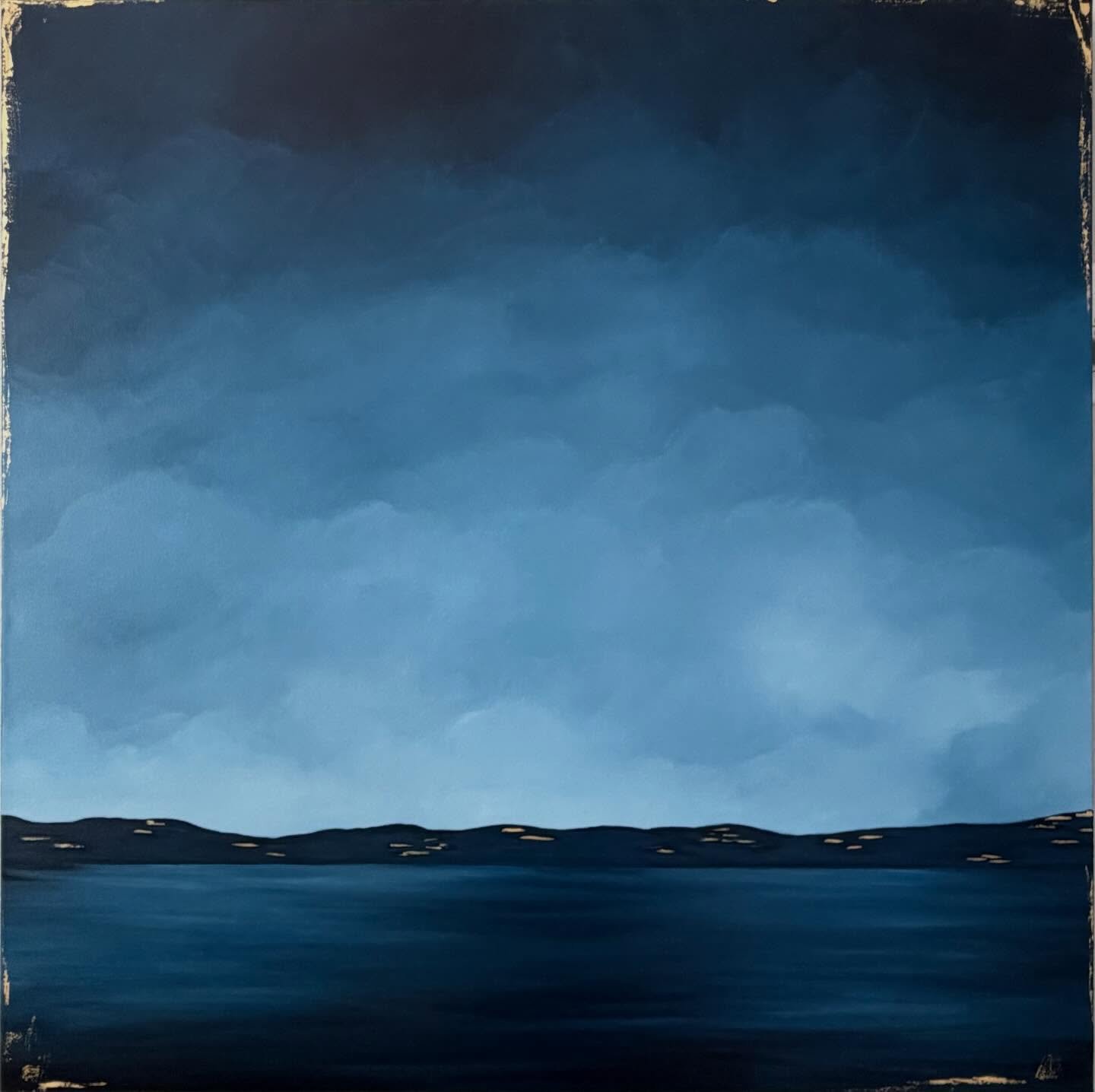 Dark Night
36 &times; 36 | Acrylic on canvas

A serene blue landscape designed to read both as a seascape and as a tonal, modern composition. Built on layered tones of deep navy, slate, soft clouded blue, the gold accents create a warm glow.  The low