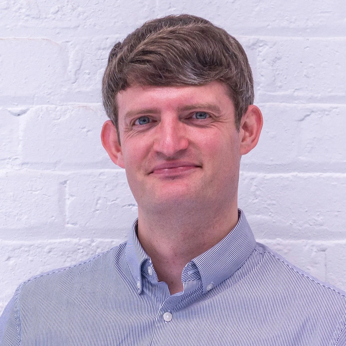 Headshot of Ewan Robertson Global Community Wealth Building Fellow at The Democracy Collaborative
