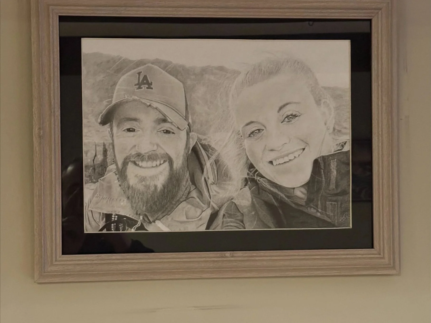 Hand Drawn Portrait of a Smiling Man Wearing a Hat Next to a Smiling Girl With Blonde Hair