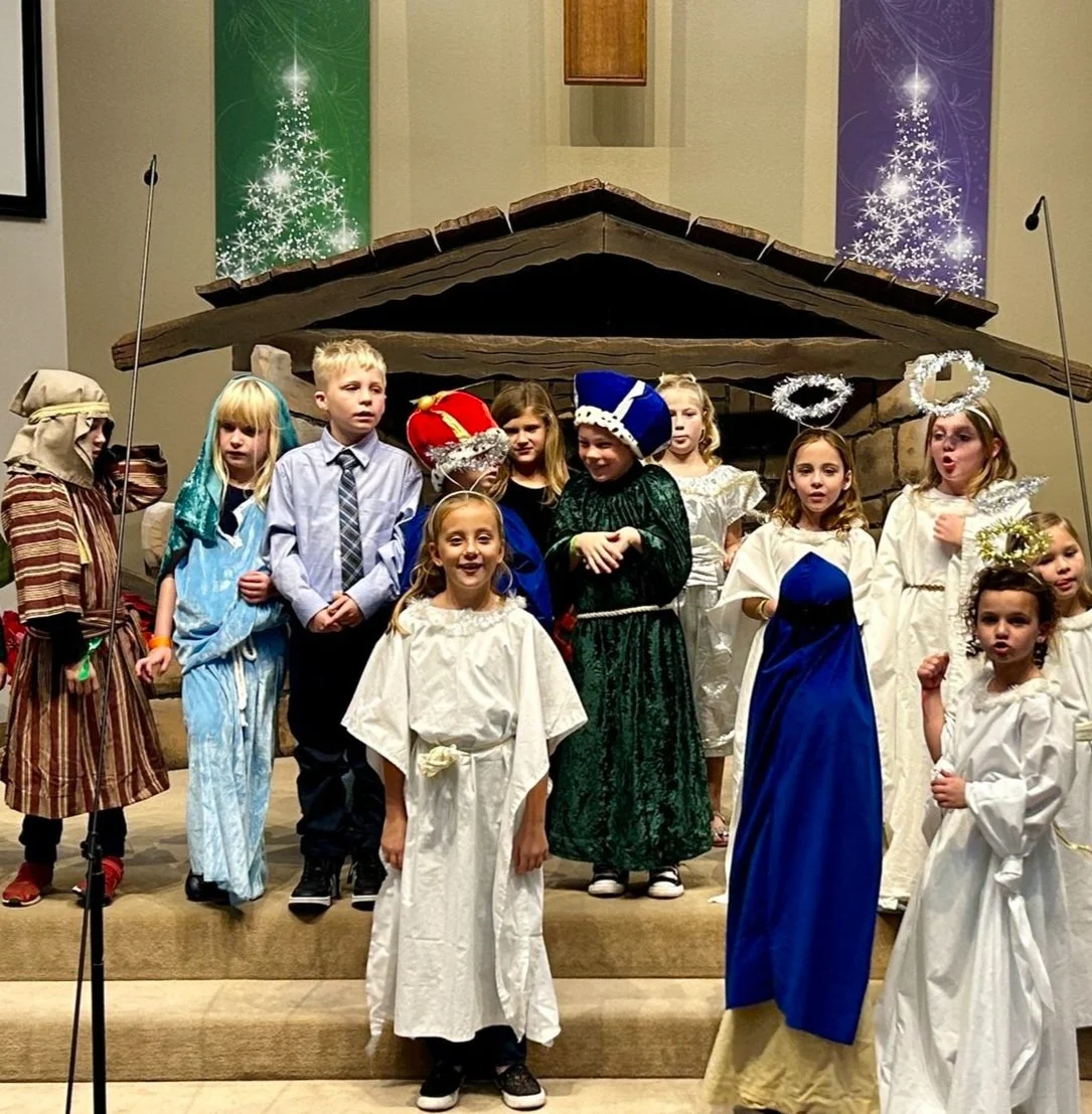 Children re-enacting the nativity during the Christmas Eve family service at Trinity Lutheran Church Temecula — Temecula CA church children’s Christmas program