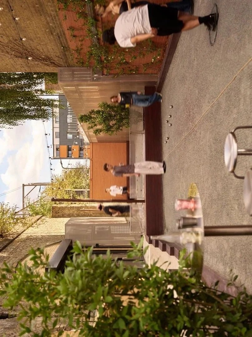 Guests playing pétanque in the outdoor yard at circle13, London Fields