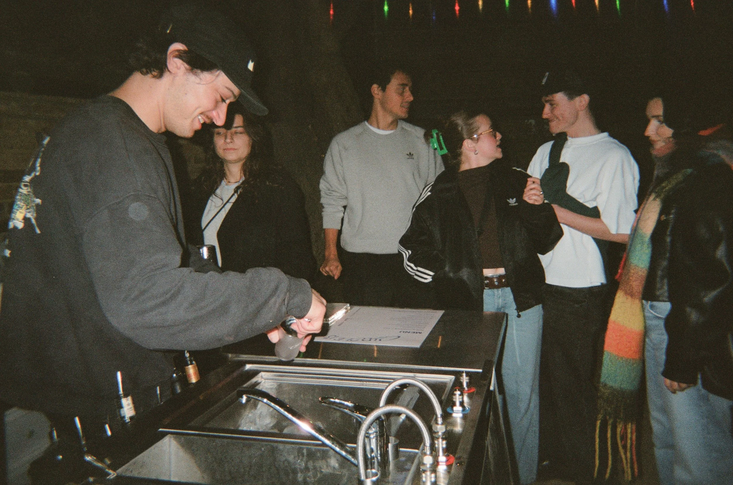 Serving drinks at a circle13 pop-up bar cart