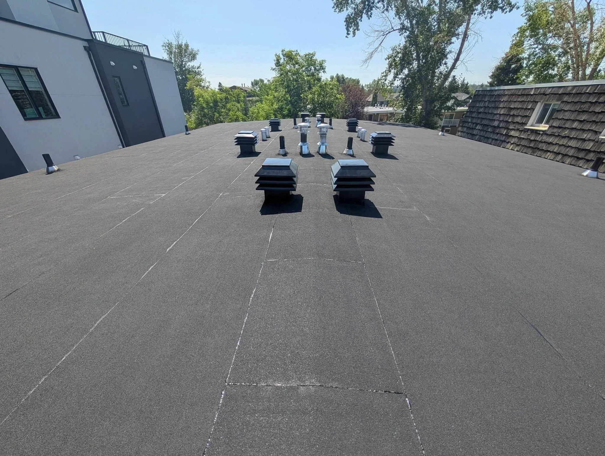 Professional torch-on flat roof installation completed. Fully insured for hot work and built to last.