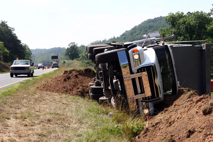 large truck rolled over in a ditch after truck wreckaccident