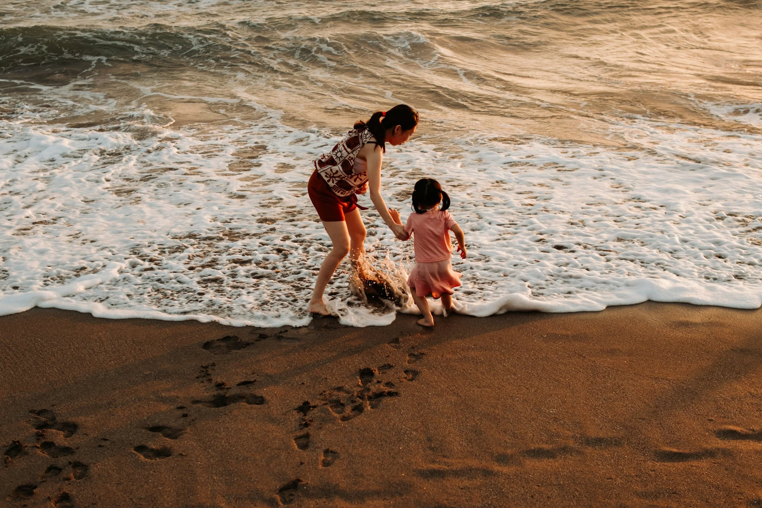 mother on the beach with her daughter