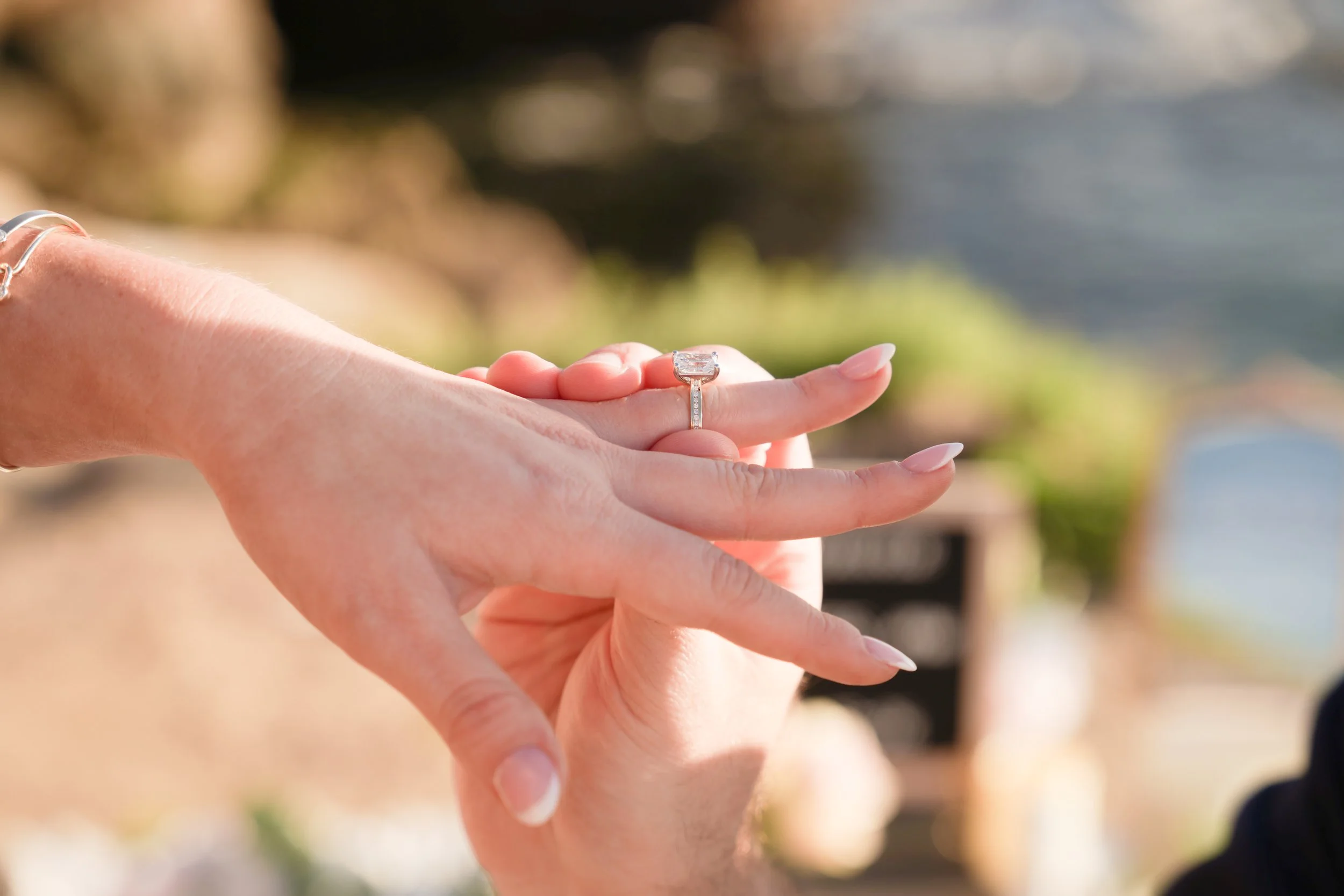 Emotional surprise proposal captured with documentary-style photography during a minimal boho decor experience