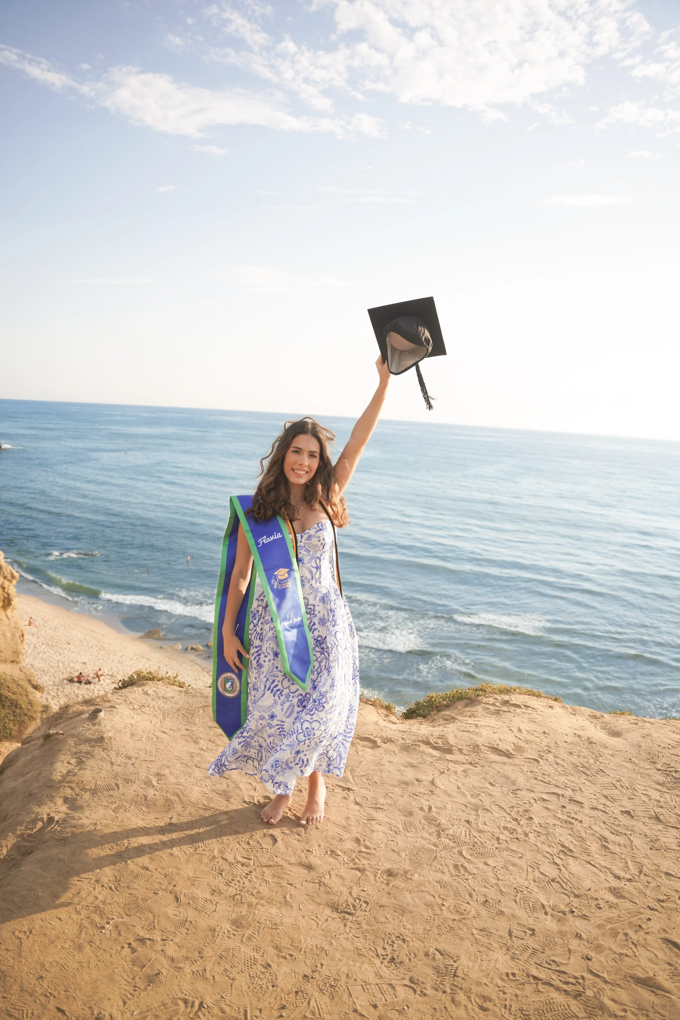 San Diego graduation photography package at Sunset Cliffs, showcasing golden hour cap and gown portraits along California’s most iconic coastal backdrop.