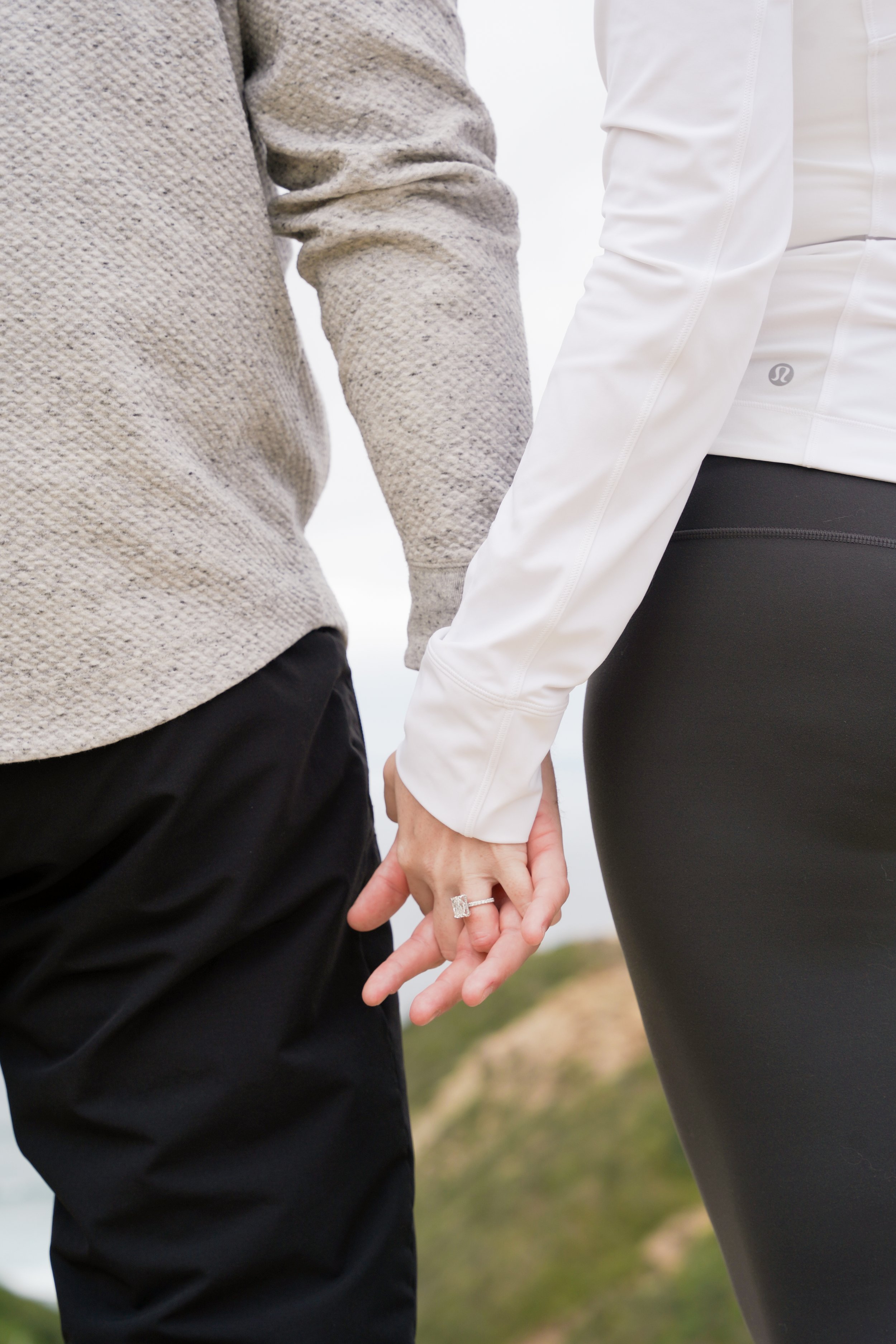 Surprise proposal captured on the Saigon Trail hike in La Jolla, with stunning views of the Pacific Ocean. Book our Undercover Yes Proposal Package for an unforgettable, discreetly captured moment.