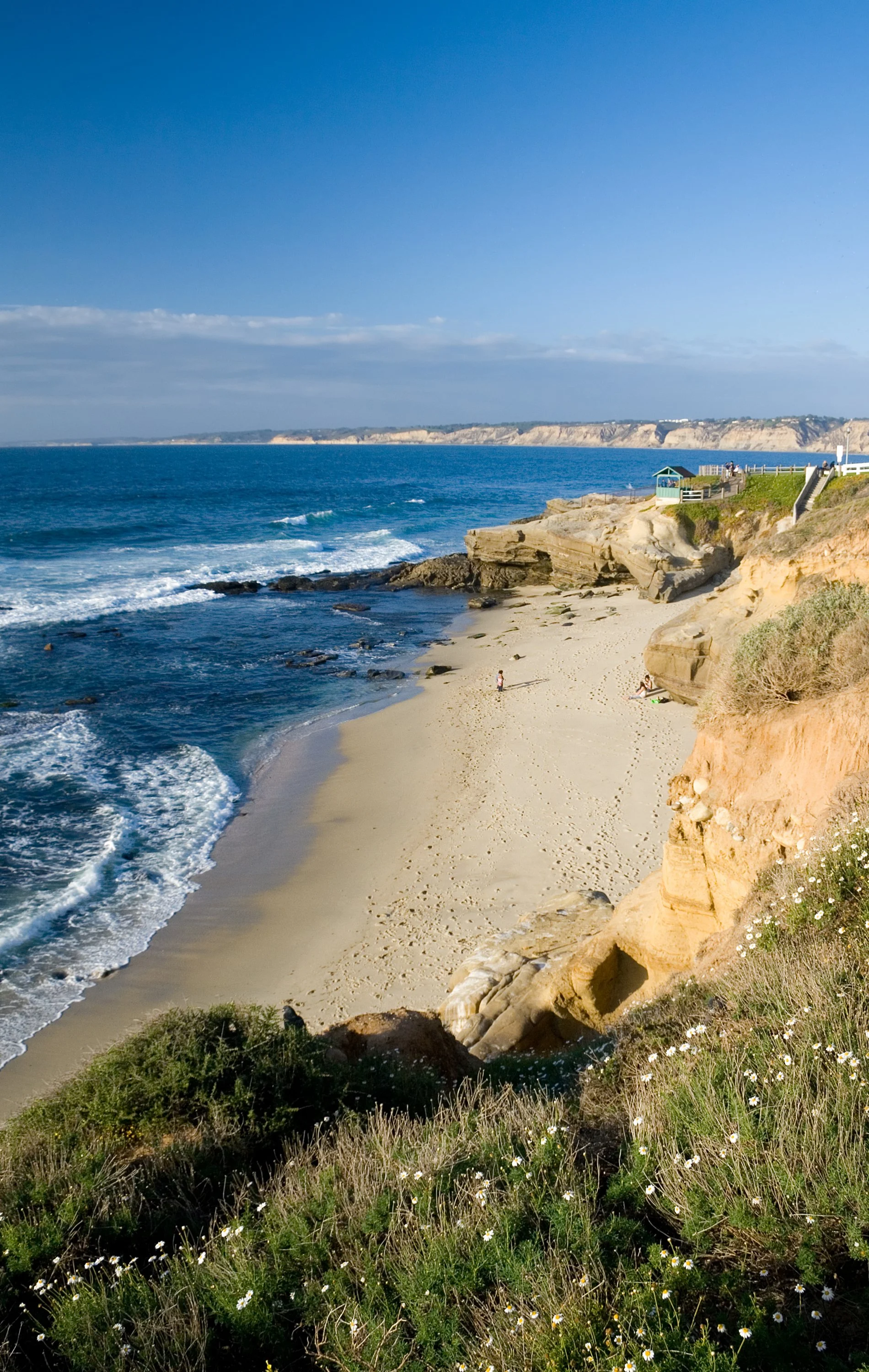 Shell Beach in La Jolla, San Diego at golden hour with tide pools, rugged rocks, and intimate shoreline — a secluded and romantic location for engagement photography and surprise proposals.