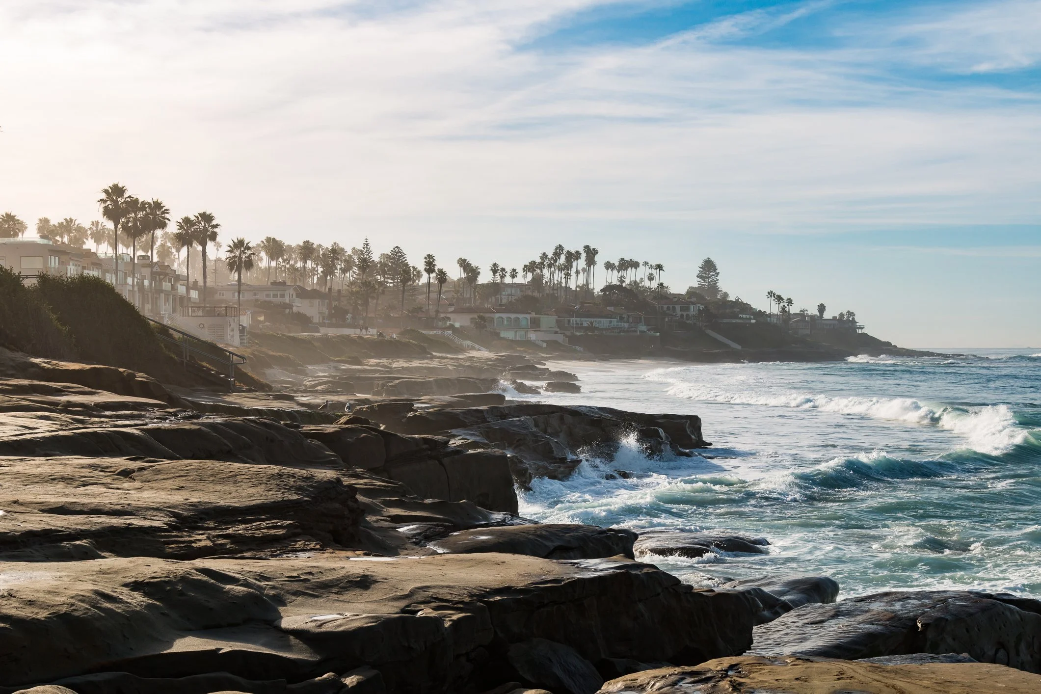 Windansea’s dramatic rocks and surf shack create a cinematic proposal setting. Let our Undercover Yes package tell your story.