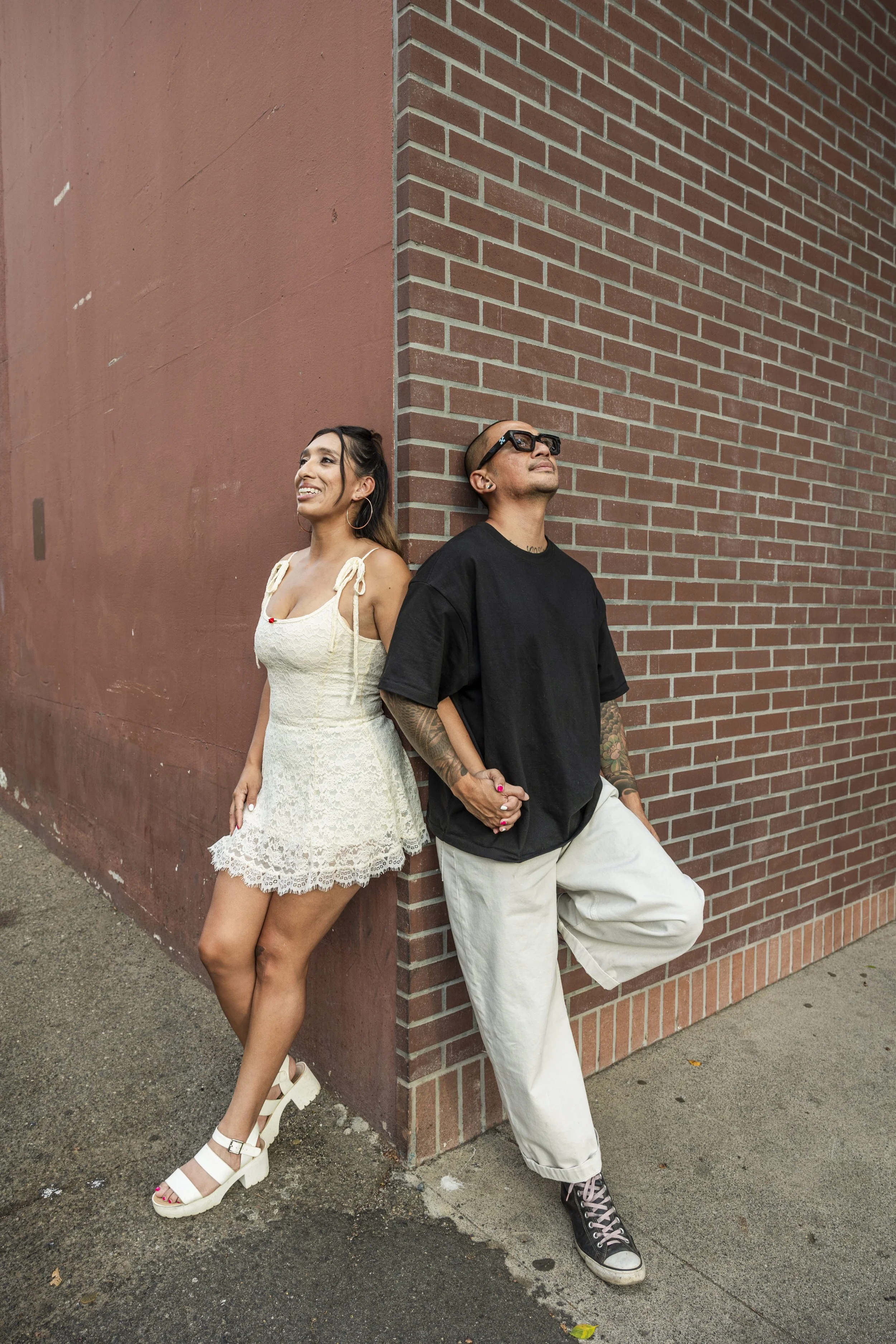  Romantic couples portrait session in downtown Redlands featuring brick walls and vintage charm for engagement photography.    
