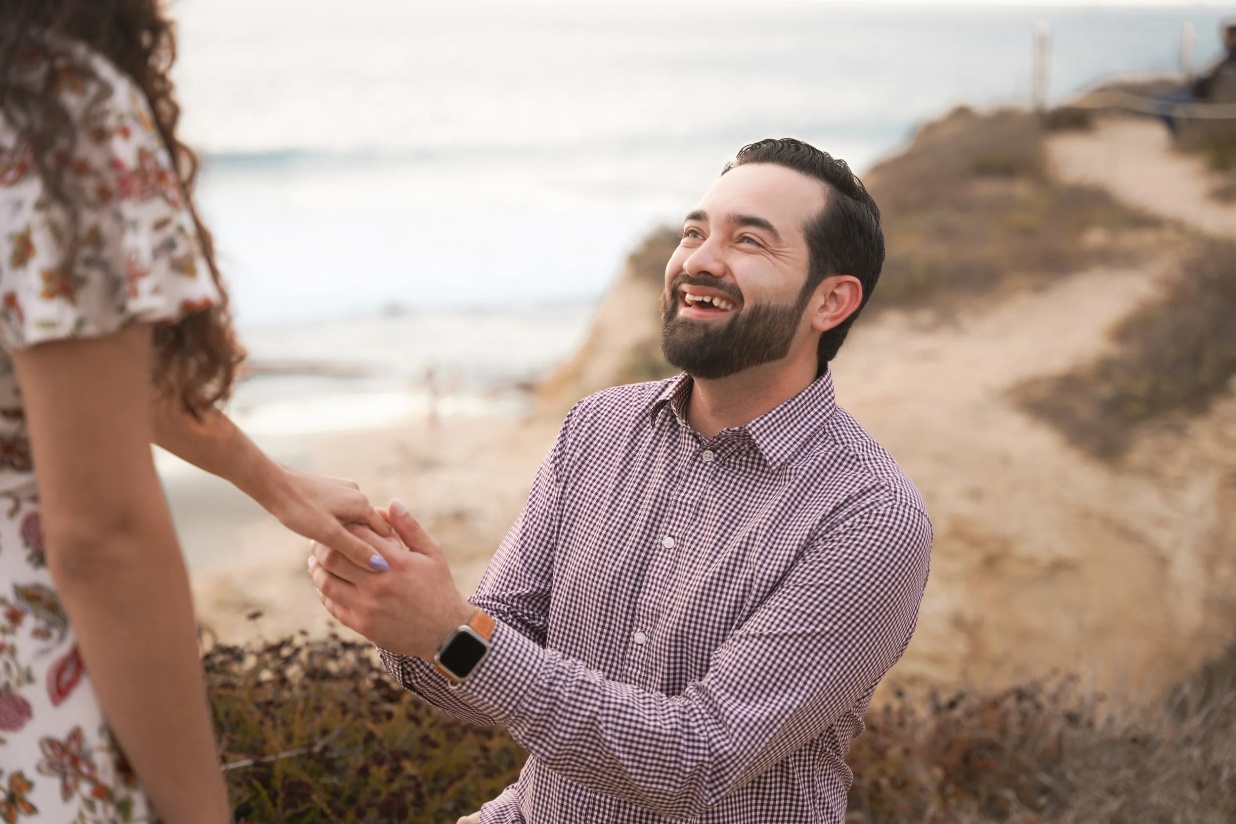 Stunning engagement proposal at Crystal Cove with dramatic coastal views — let us plan your stress-free shoot.
