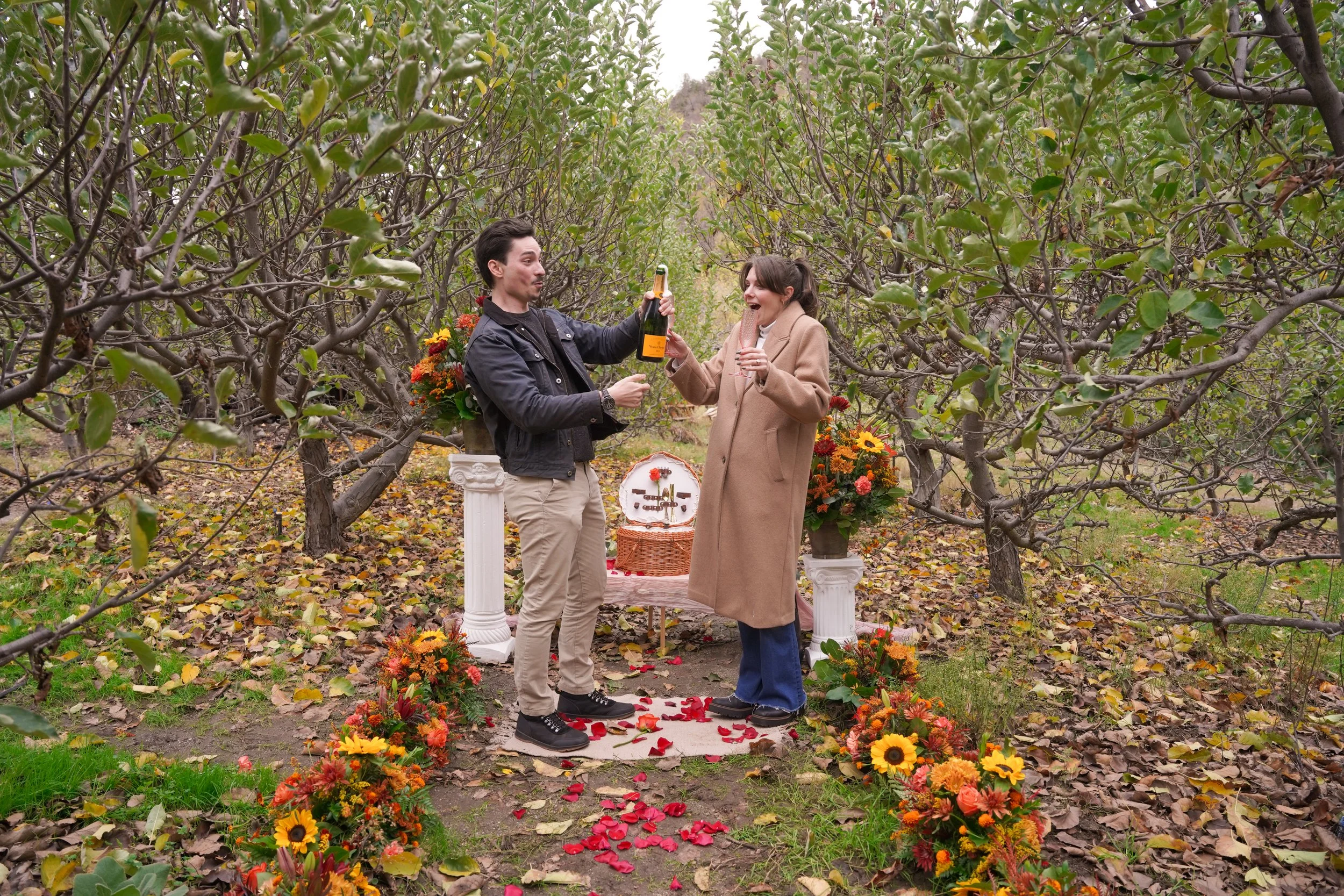 Couple Celebrating Engagement with Apple Donuts at Snow-Line Orchard Oak Glen