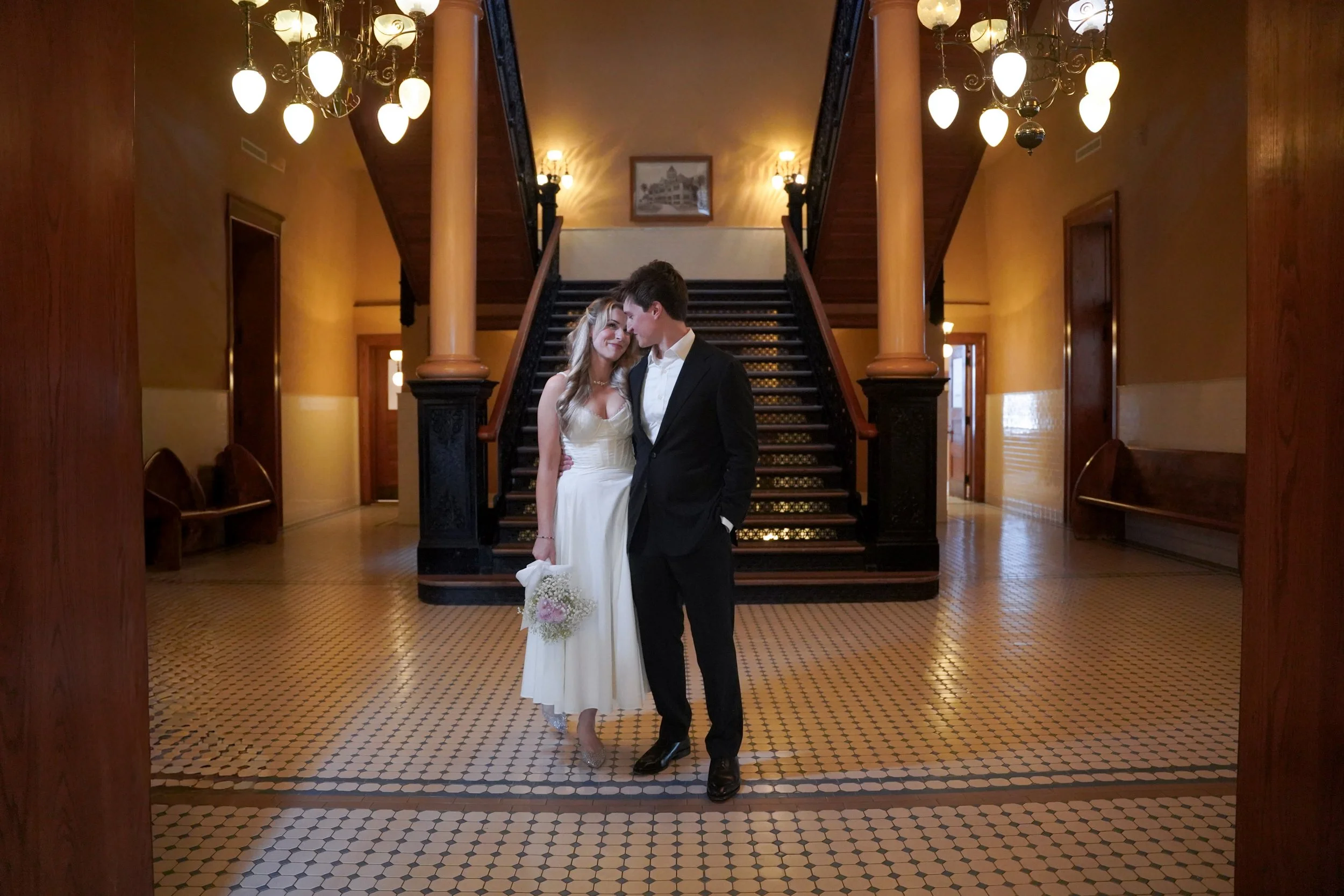Post-Ceremony Hug Inside Courthouse Interior