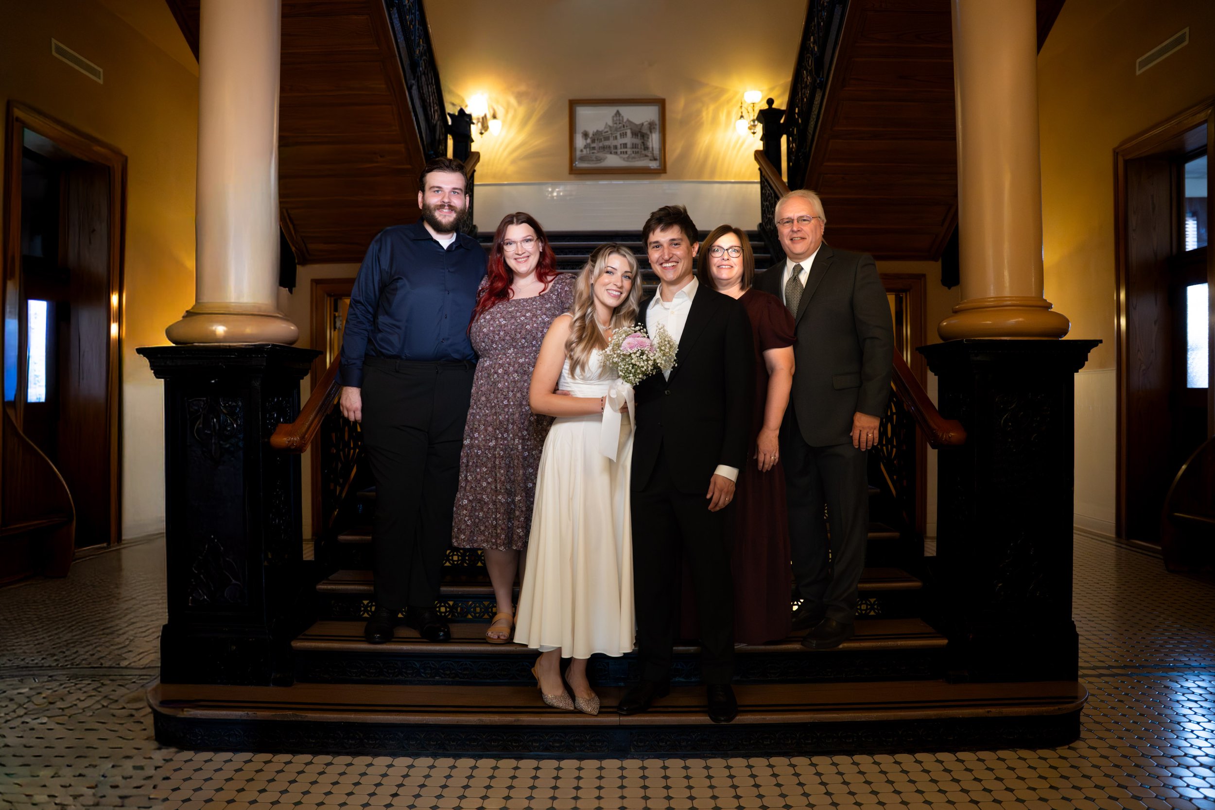 Family Celebration on Courthouse Staircase After Ceremony