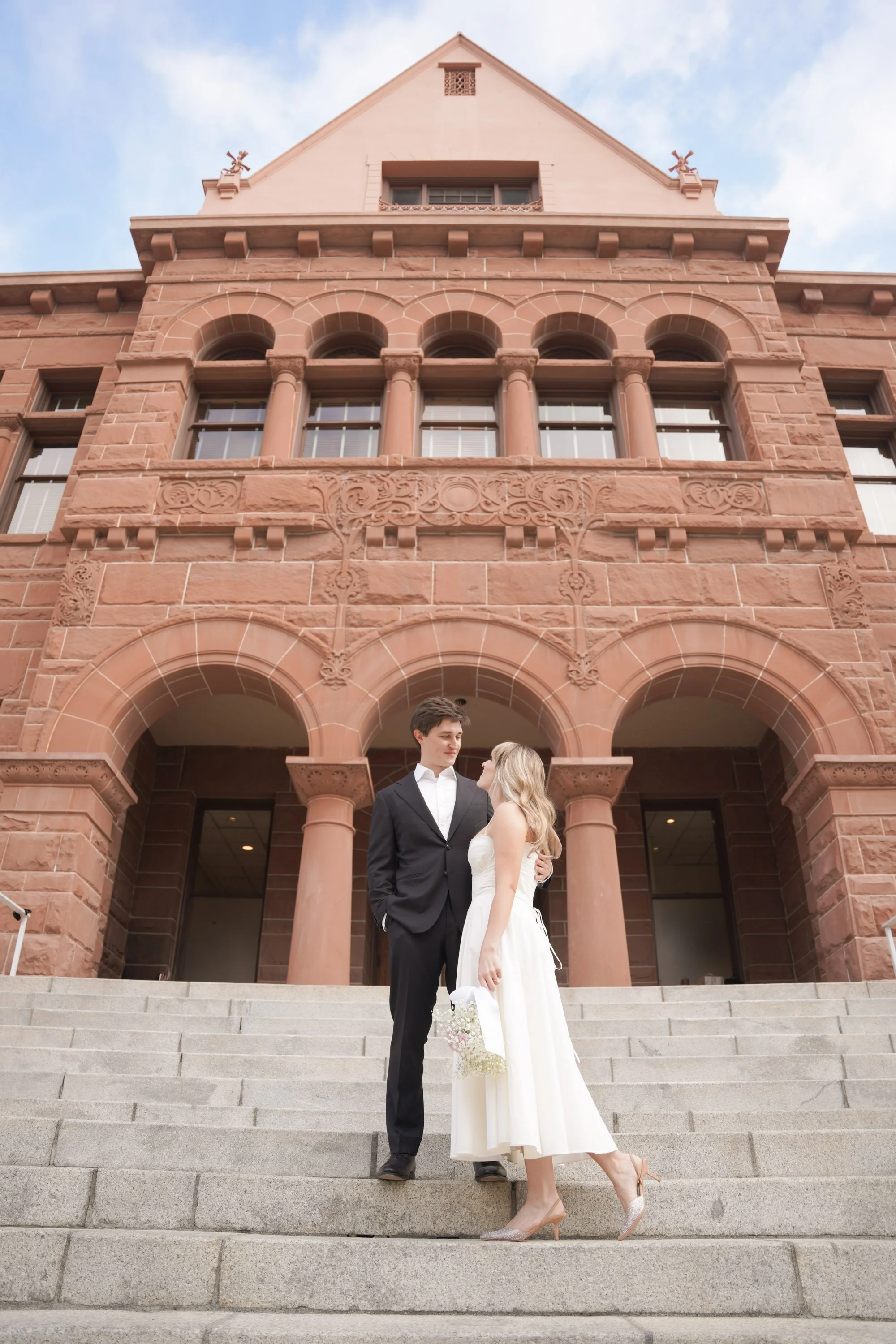 Couple Standing Still Outside Historic OC Courthouse