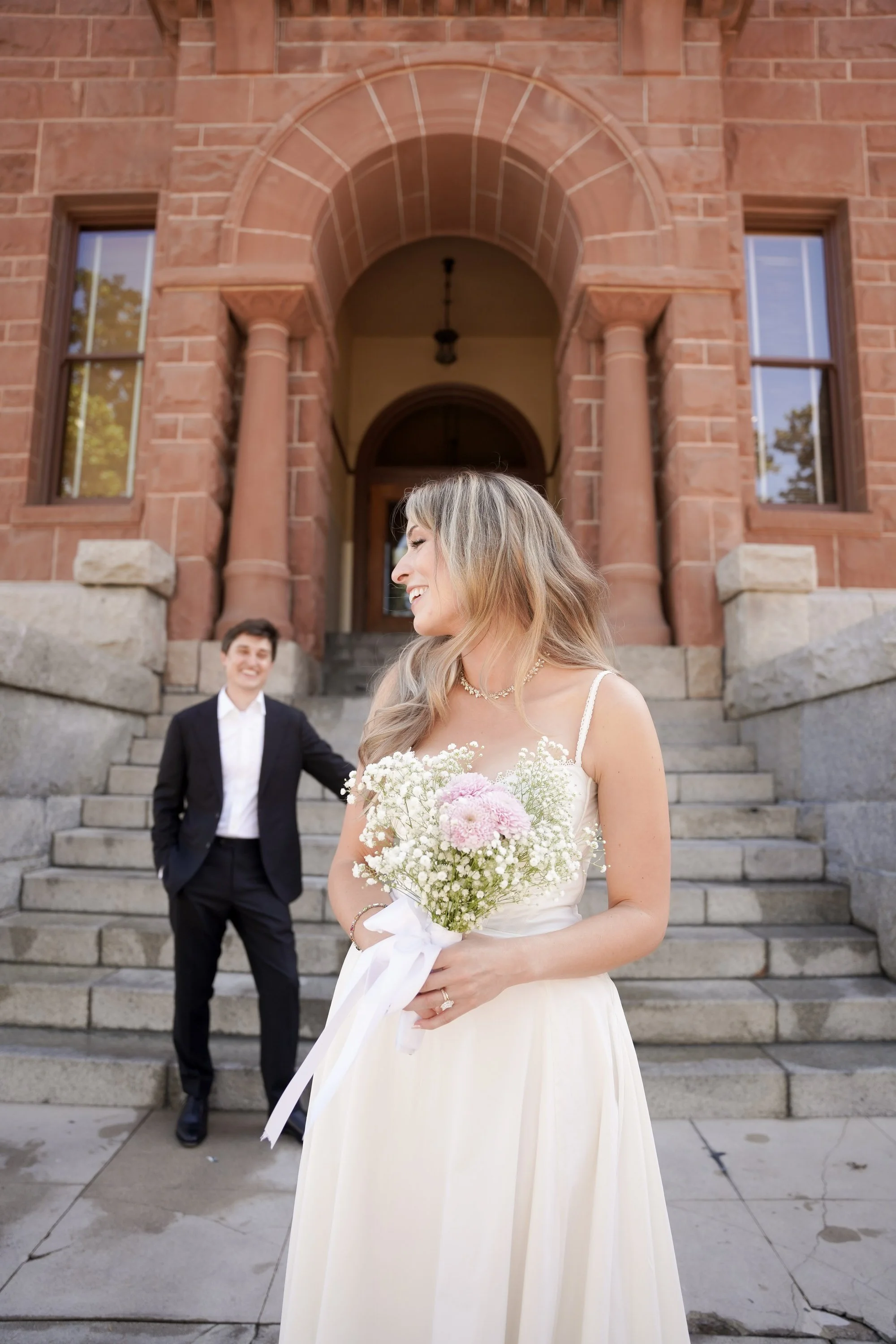 Quiet Pause Before Entering Courthouse to Marry