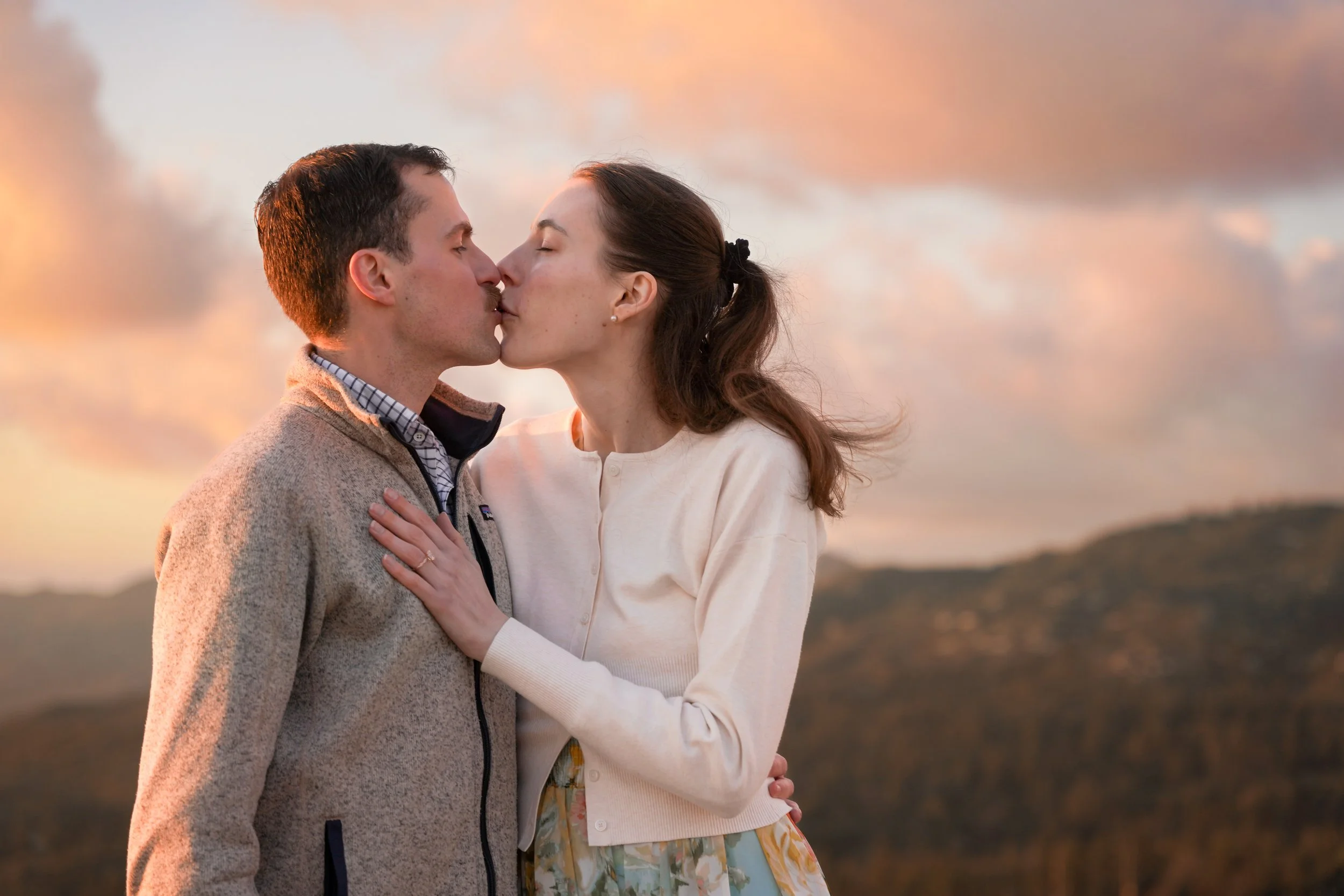 Cinematic proposal photography with mountain overlook backdrop