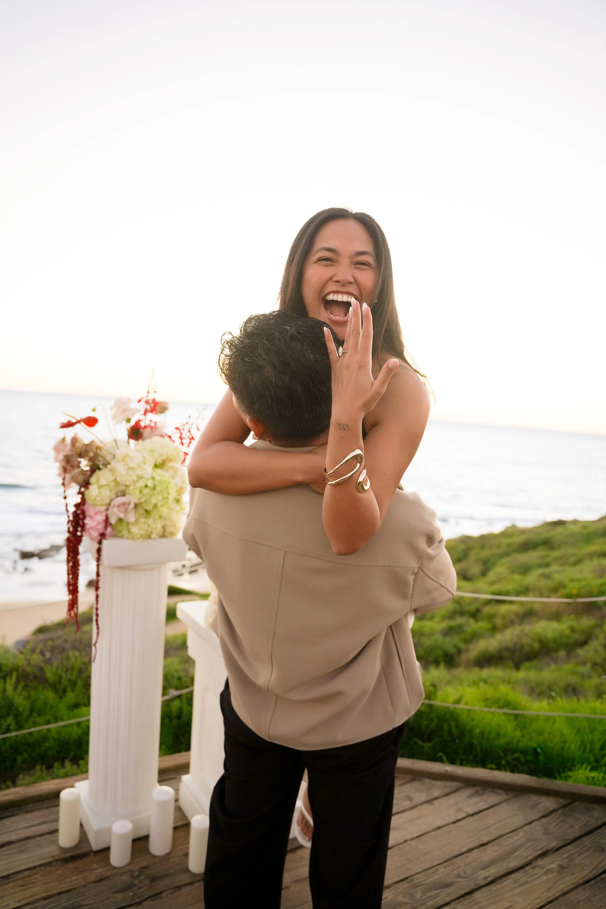Celebratory Engagement Moment at Crystal Cove State Beach