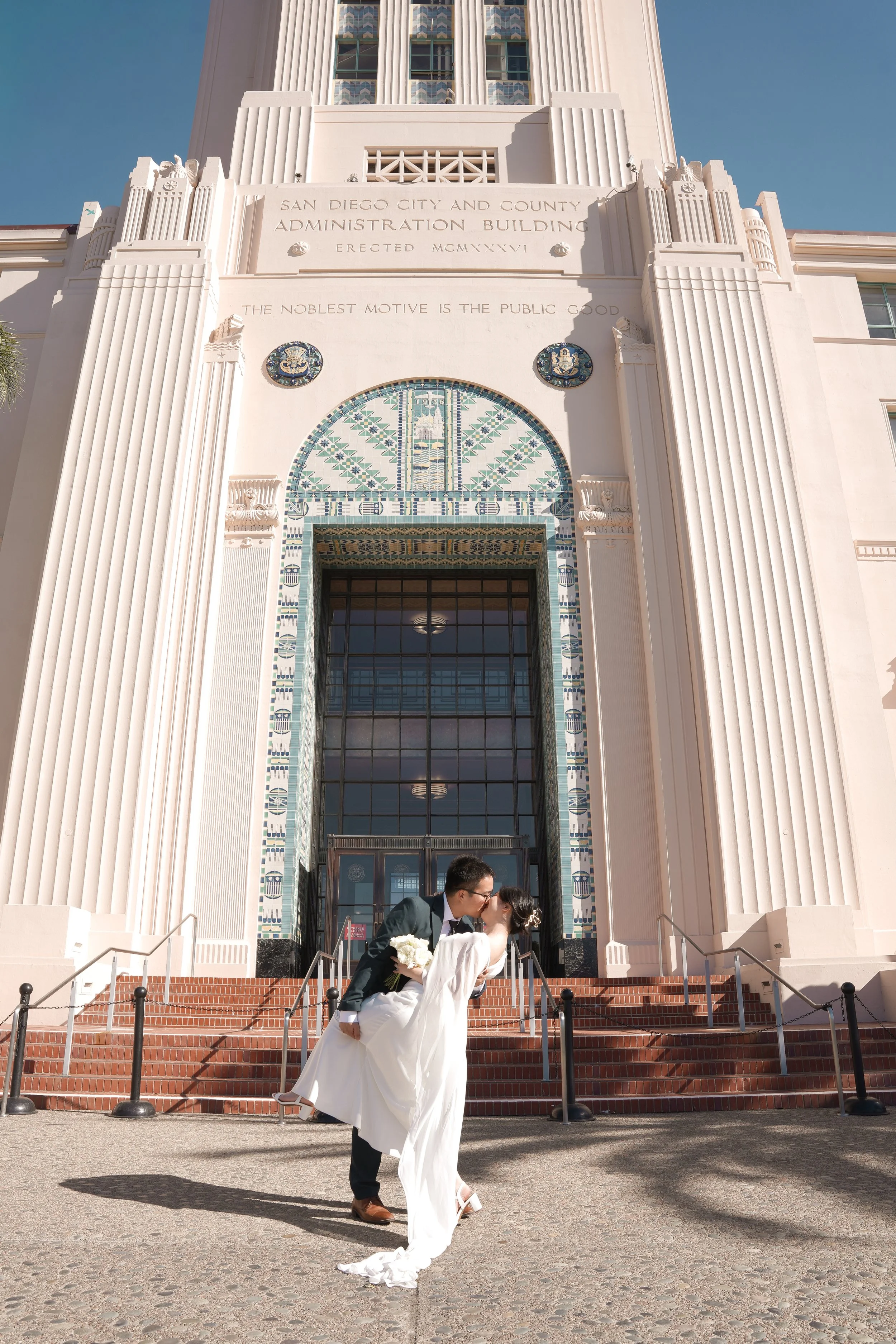 Couple celebrating their marriage with elegant just married portraits following their civil courthouse wedding ceremony.