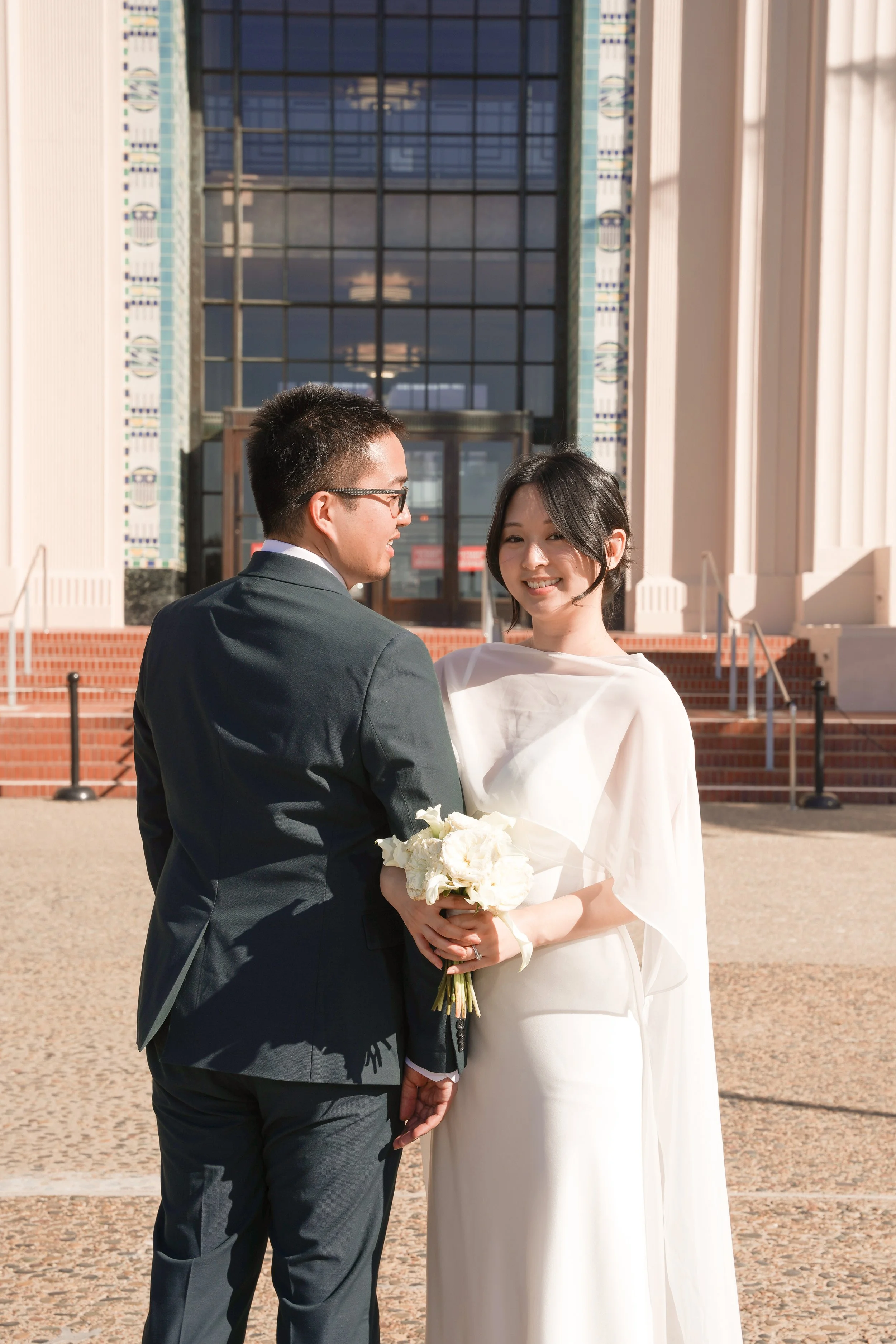 Professional courthouse wedding photography capturing newlywed portraits immediately after the civil ceremony.