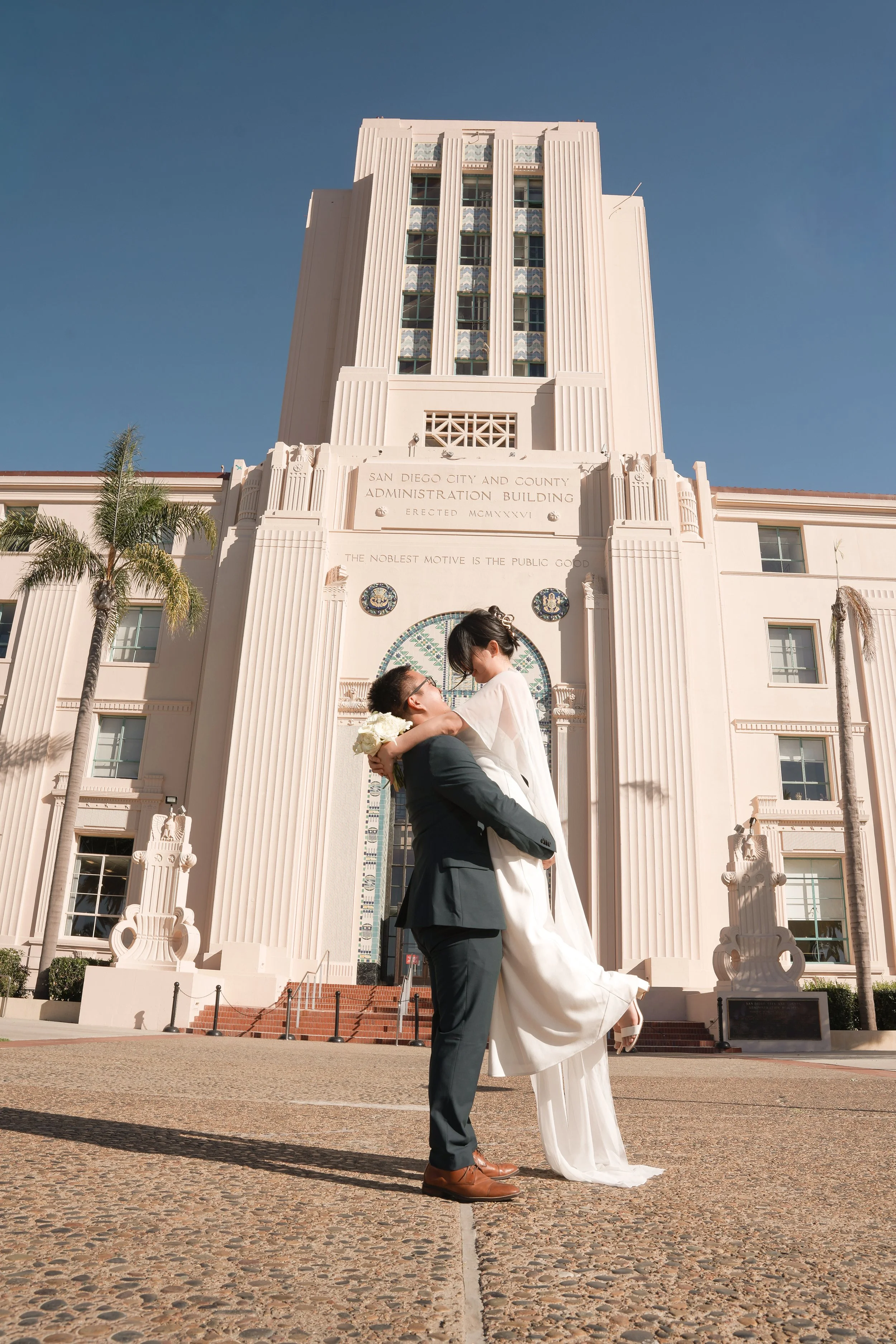 Newlywed Couple Celebrating Marriage After Courthouse Ceremony