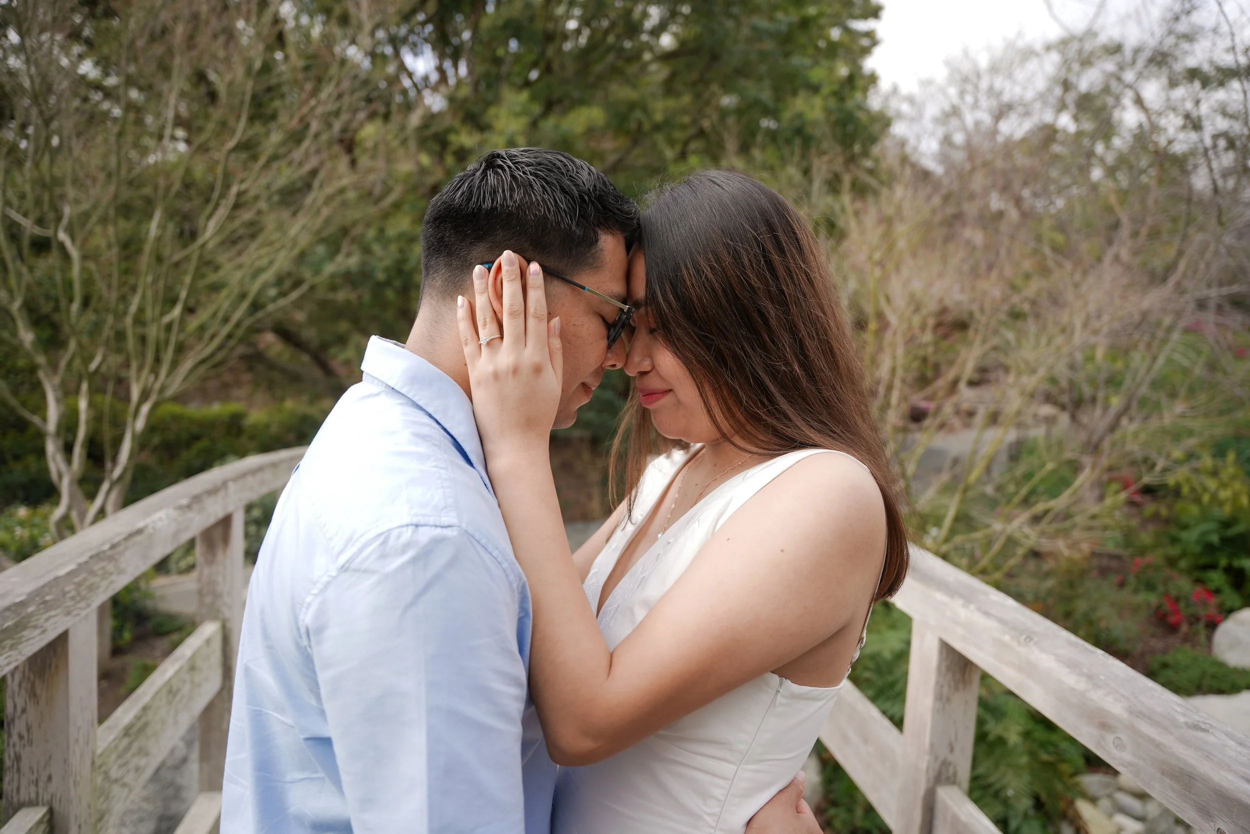 Couple Walking Through Japanese Friendship Garden After Surprise Proposal