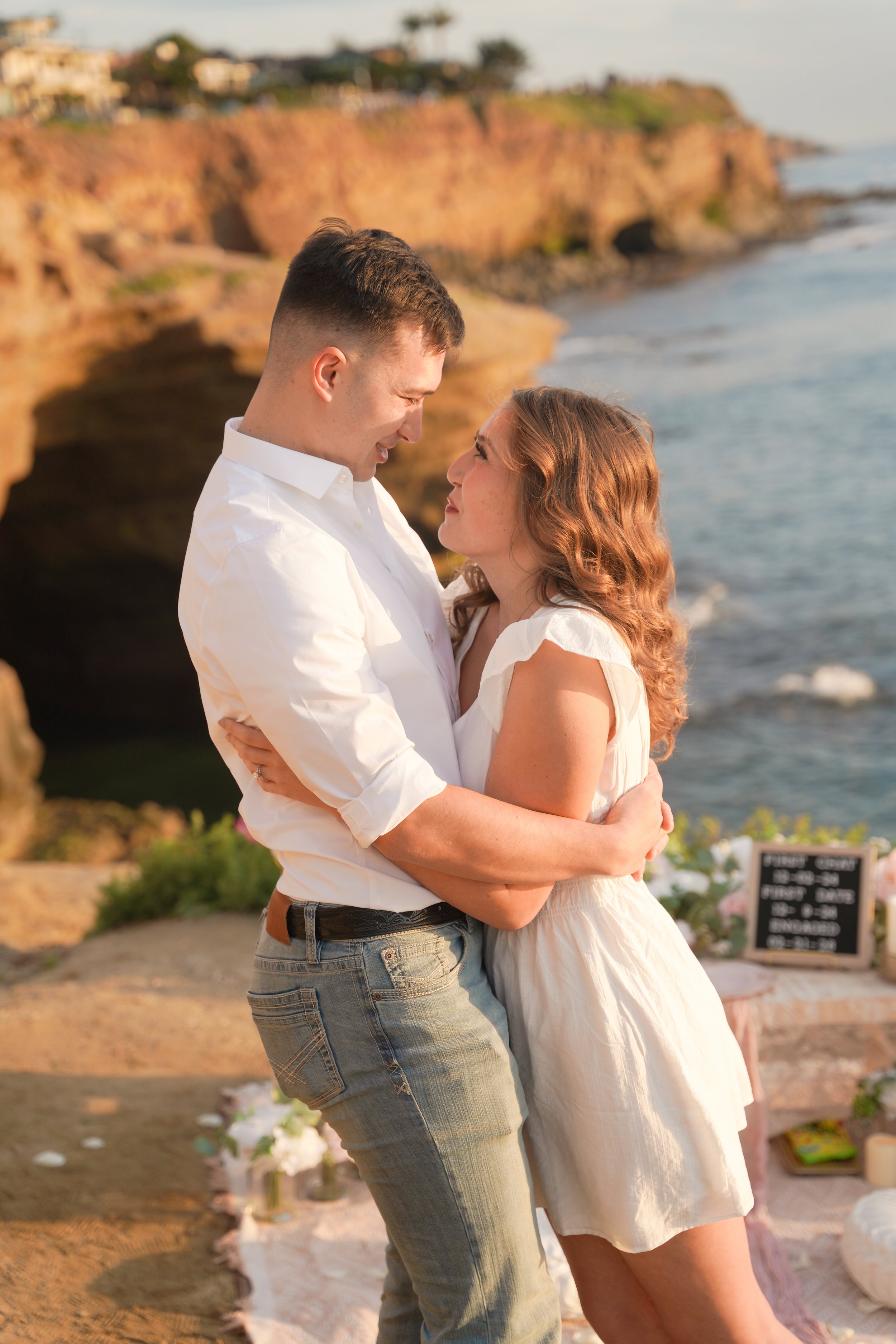 Newly Engaged Couple Celebrating After a Sunset Proposal