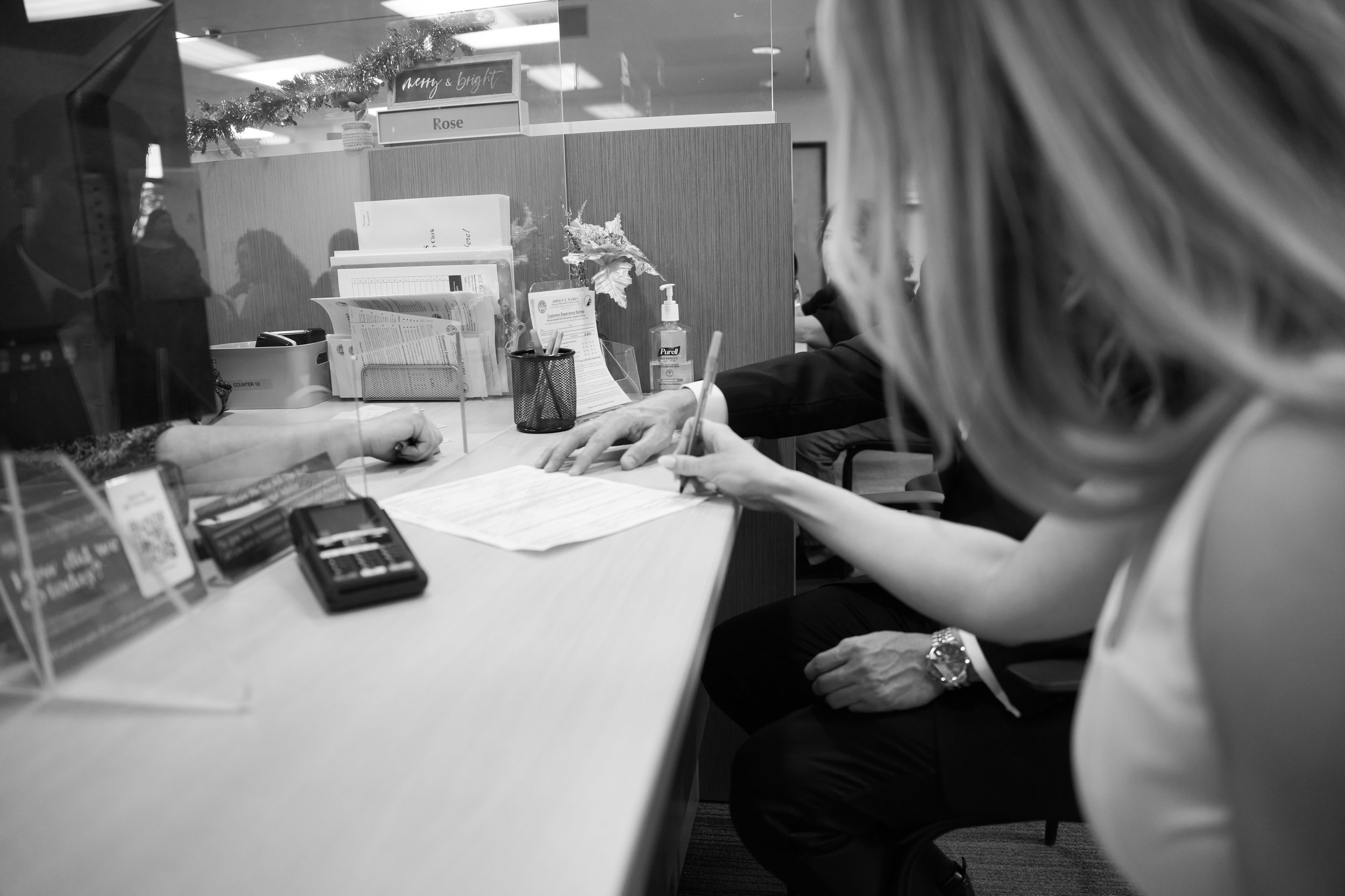 Bride and groom signing wedding documents at civil ceremony