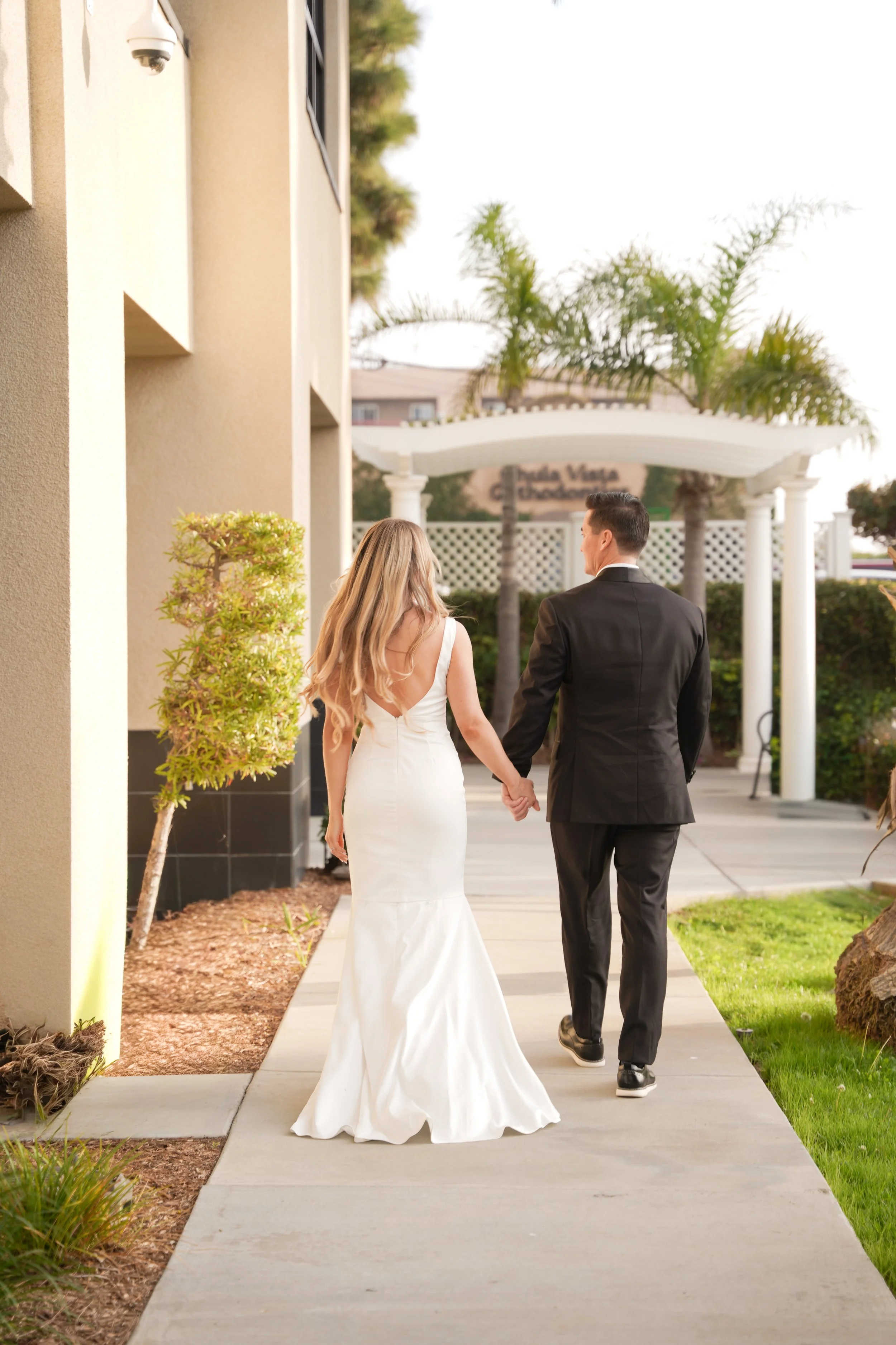 Couple Walking Toward the Ceremony Area at Chula Vista Courthouse