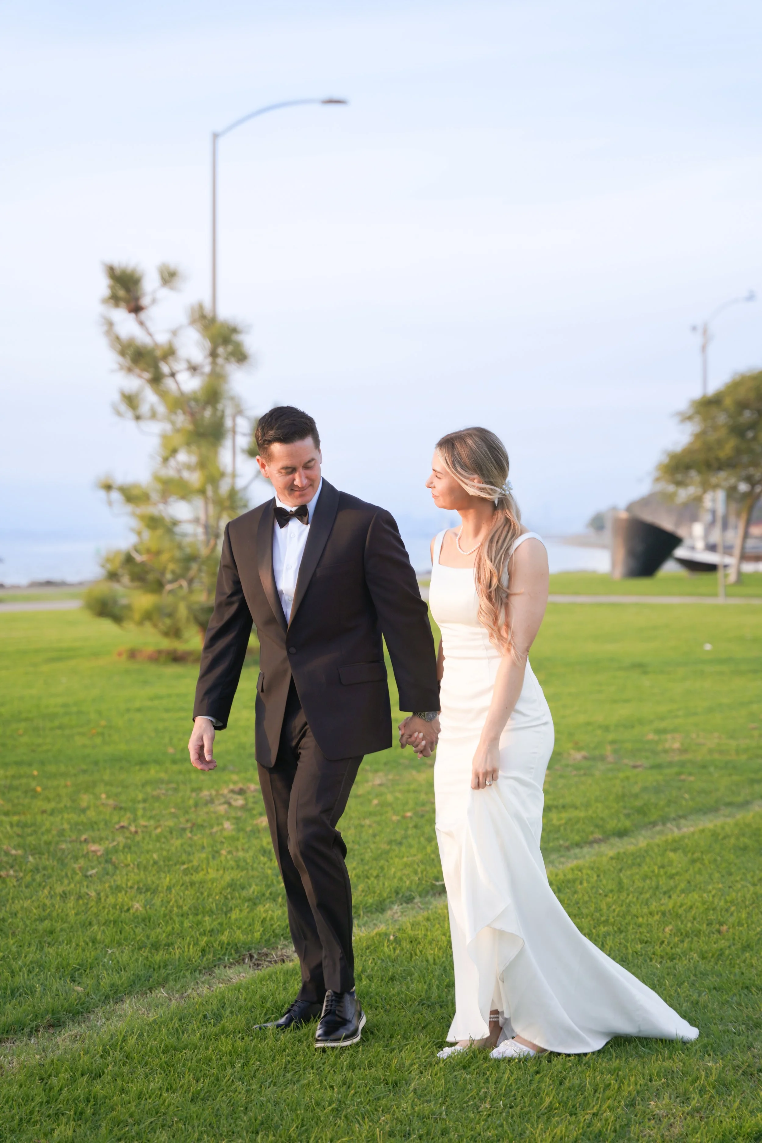 Newlywed Couple Walking Hand in Hand at Chula Vista Marina After Courthouse Wedding
