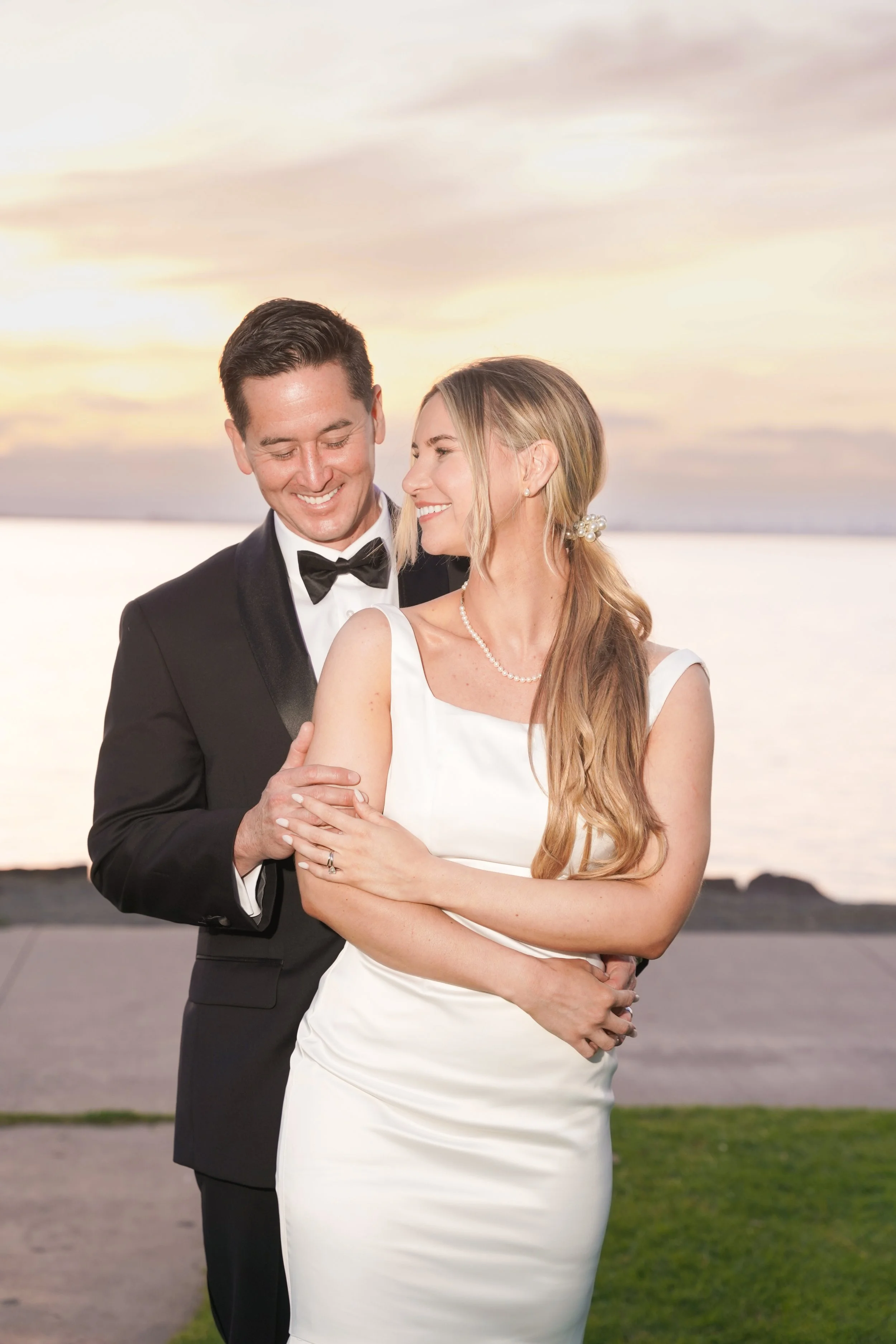 Newlyweds Embracing at Sunset at Chula Vista Marina After Civil Ceremony