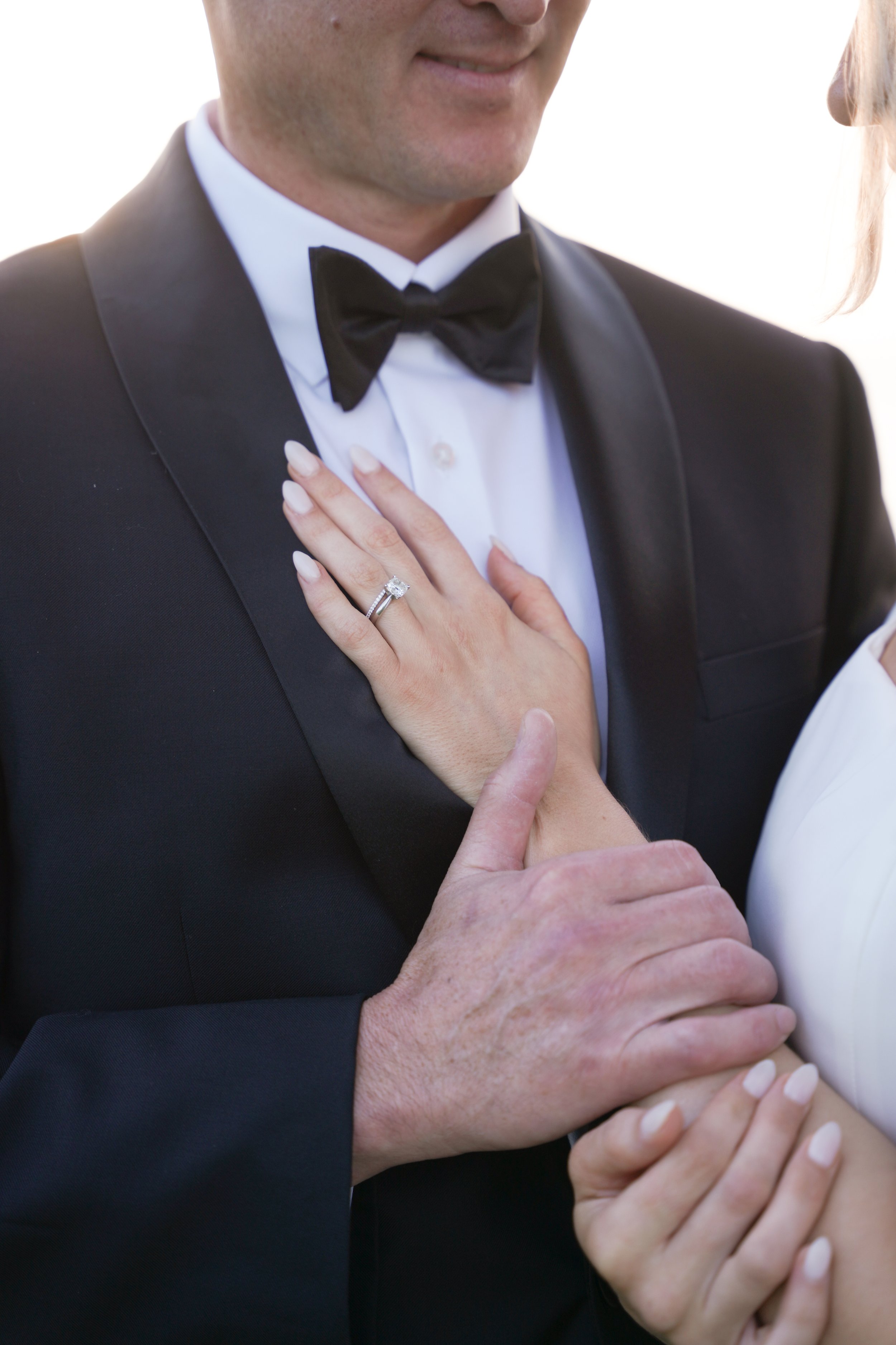 Bride Placing Hand on Groom’s Chest During Marina Portraits After Courthouse Wedding