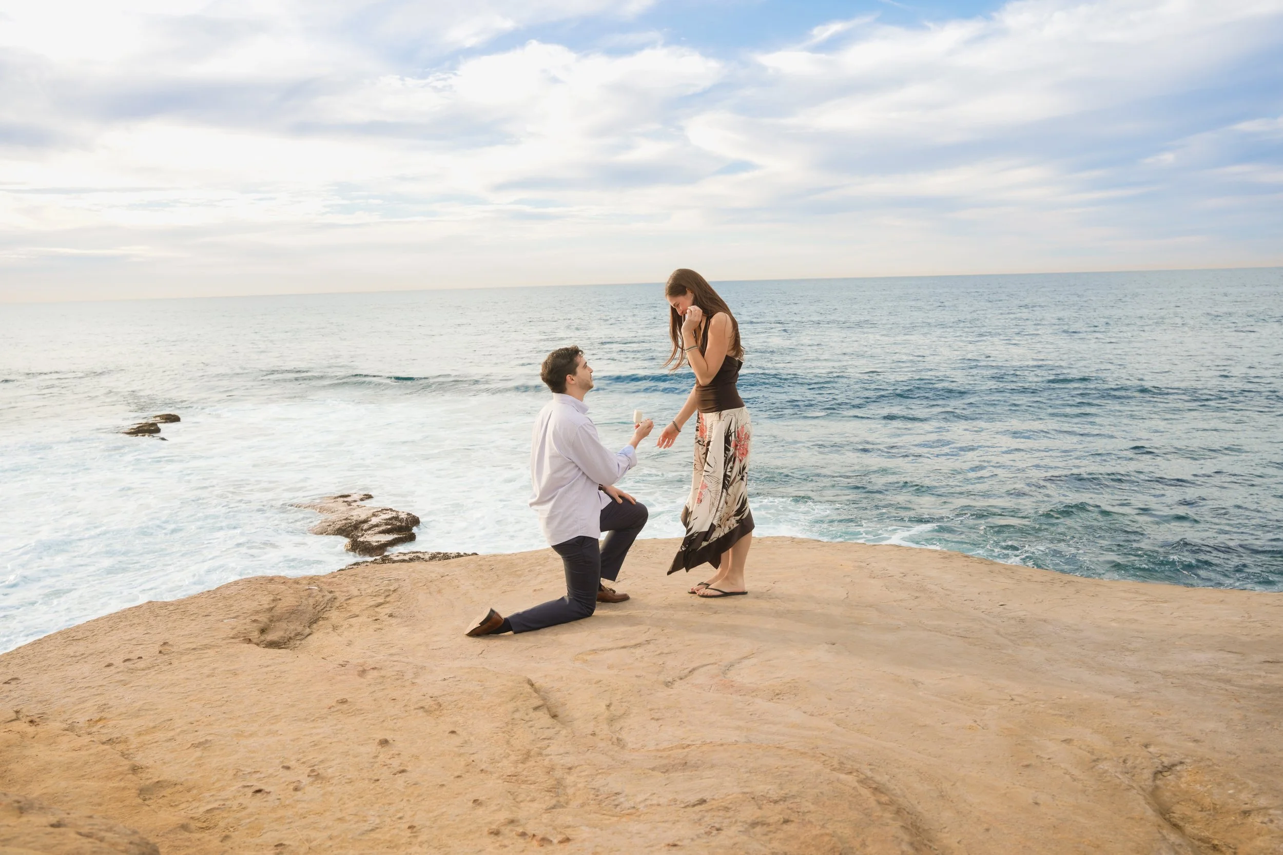 La Jolla Surprise Proposal Couple Celebrating by the Ocean